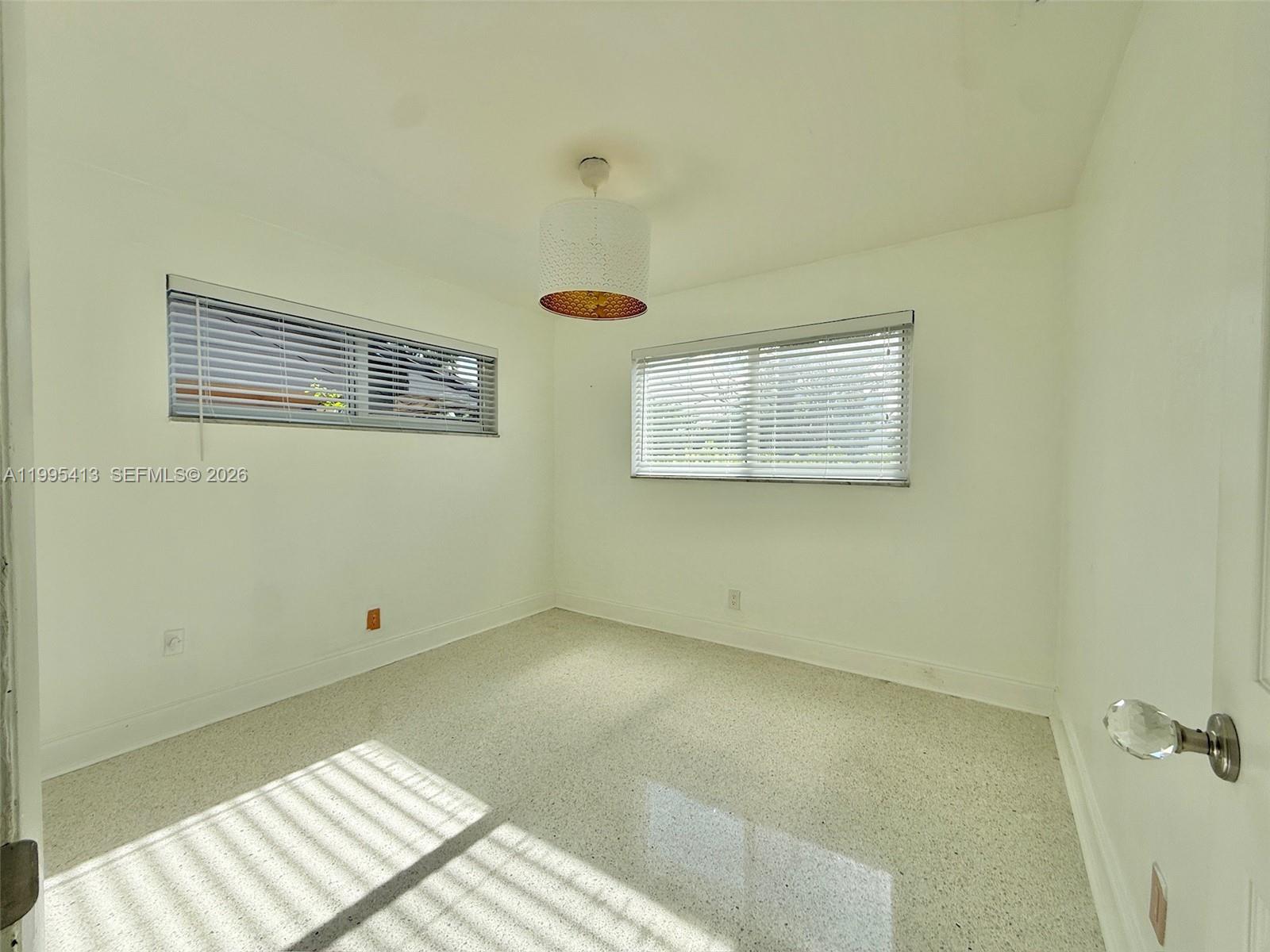 Well-appointed guest bedroom at 207 12th Ave - Home in Dania Beach