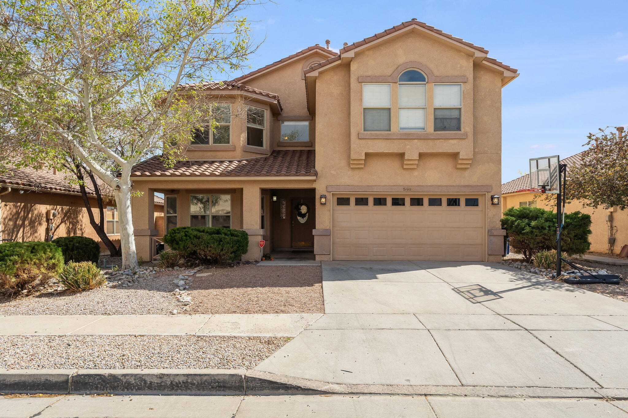 Great open Floorpan. Spacious Master and Bonus Recreation Room. Cherry cabinets and sitting island in Kitchen.  Lovely landscaping front and rear. Great views relaxing area off Balcony. North facing windows. Refrigerated air. This beautiful home is close to shopping areas and access to interstate. Come have a look for yourself at this spacious home in North West Albuquerque.