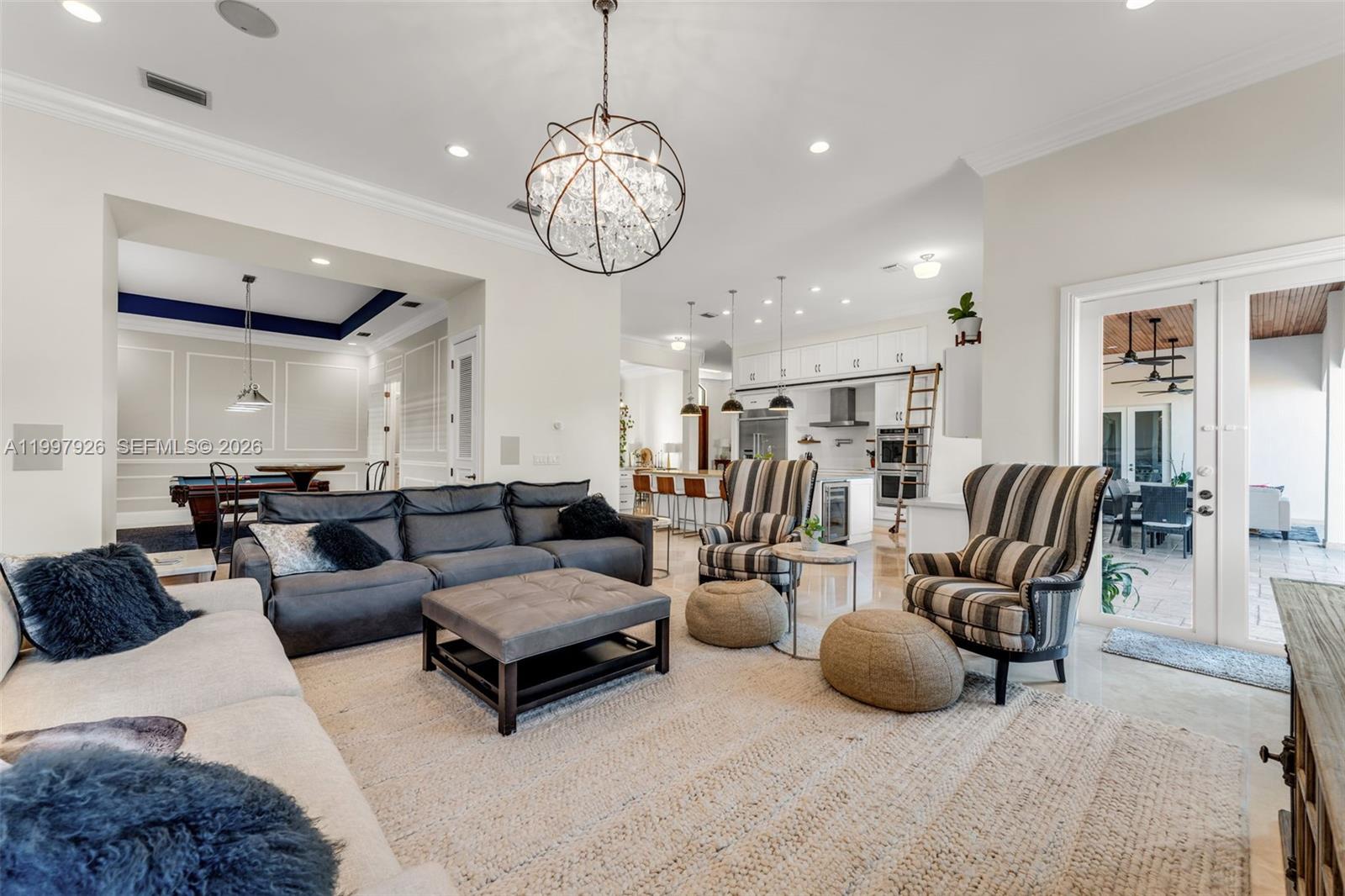 Newly remodeled, turnkey masterpiece is nestled in the prestigious Triple Estates neighborhood of Palmetto Bay, one of South Florida's most coveted addresses. From the moment you step inside, high-end finishes and thoughtful design details make it clear that no expense was spared.Elegant formal living and dining rooms flow seamlessly into the crown jewel of the home: a show-stopping chef's kitchen boasting a massive center island, premium appliances, and a fully concealed prep kitchen; an entertainer's dream and a culinary enthusiast's paradise. The expansive family room offers the perfect backdrop for gatherings of any size, while the generous billiard room, easily large enough to accommodate a regulation-size pool table, presents exciting versatility to convert it into a 5th bedroom, private home office, or media room, offering a flexible space to suit your lifestyle.The gorgeous primary suite is anchored by a spa-inspired bathroom adorned with luxurious sky-blue porcelain tile, marble accents, and a double vanity that radiates five-star elegance.Outside a fully fenced backyard oasis, thoughtfully designed for ultimate privacy with ample space to park your boat, a rare find in this community.All of this, just minutes from the scenic waterways of Deering Bay, with easy access to nature trails, jogging paths, bike routes, and a golf cart-friendly atmosphere. Top-rated schools round out this extraordinary opportunity.This is the one you've been waiting for!