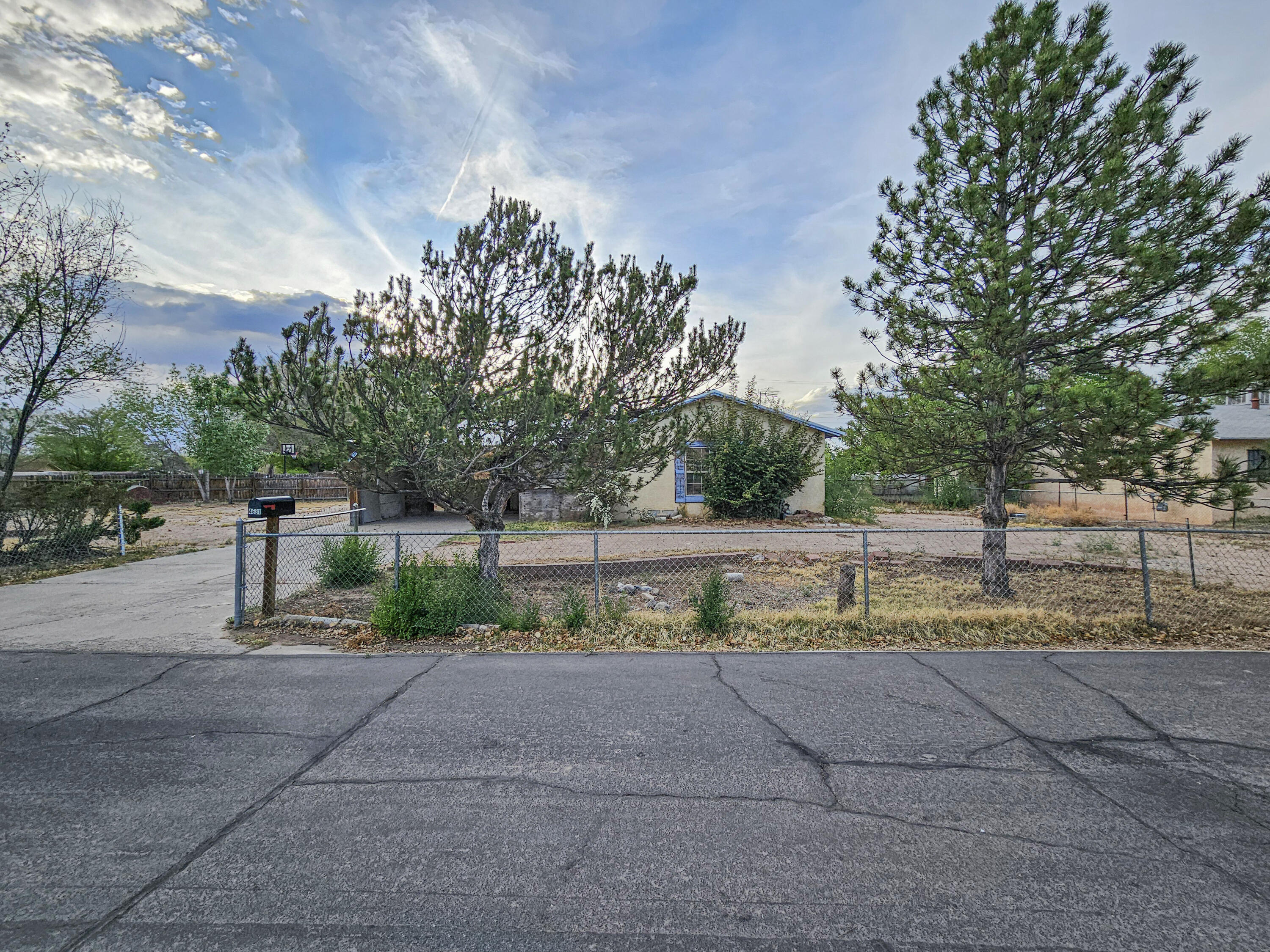 Great Opportunity - Fixer Upper! This South Valley property offers incredible potential for the right buyer. Situated on a spacious 0.28-acre lot, this home is ready for your personal touch and will require some work. Perfect for investors or those looking to customize their own dream space. The large yard provides plenty of room for parking, outdoor living, or future improvements. With its generous lot size and great location, this property is full of possibilities. Don't miss out; come take a look and see the potential!