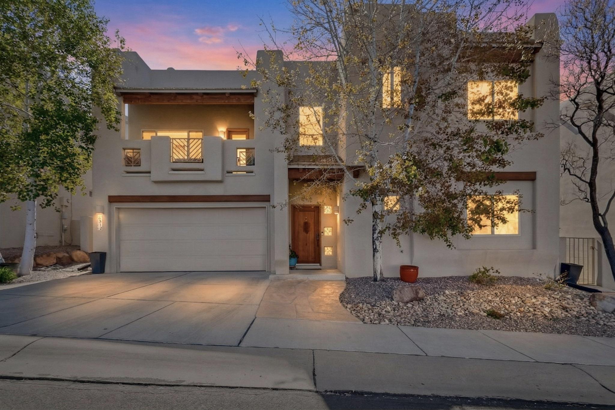 Light filled 4 BEDROOM & 3 FULL BATH home in the highly desirable GATED community of Enclave @ High Desert showcasing SW character & charm w tongue & groove ceilings & decoartive beams. Kitchen offers granite countertops, stainless steel appliances, tasteful updates inside & out complimented by updated paint, flooring & carpet for a fresh, move in ready feel . Main level BR w adjacent FULL BATH provides flexible living or guest accomodations. Upstairs you'll find 3 more bedrooms w ample closet space, a full bath & a spacious primary suite w jetted tub & oversized shower. The low maintenance yard allows time to enjoy  hiking/biking trails & open space that surround the Sandia foothills or sit back & enjoy the evening sunsets & city lights on the upper balcony. Furnace/AC unit updated 2024