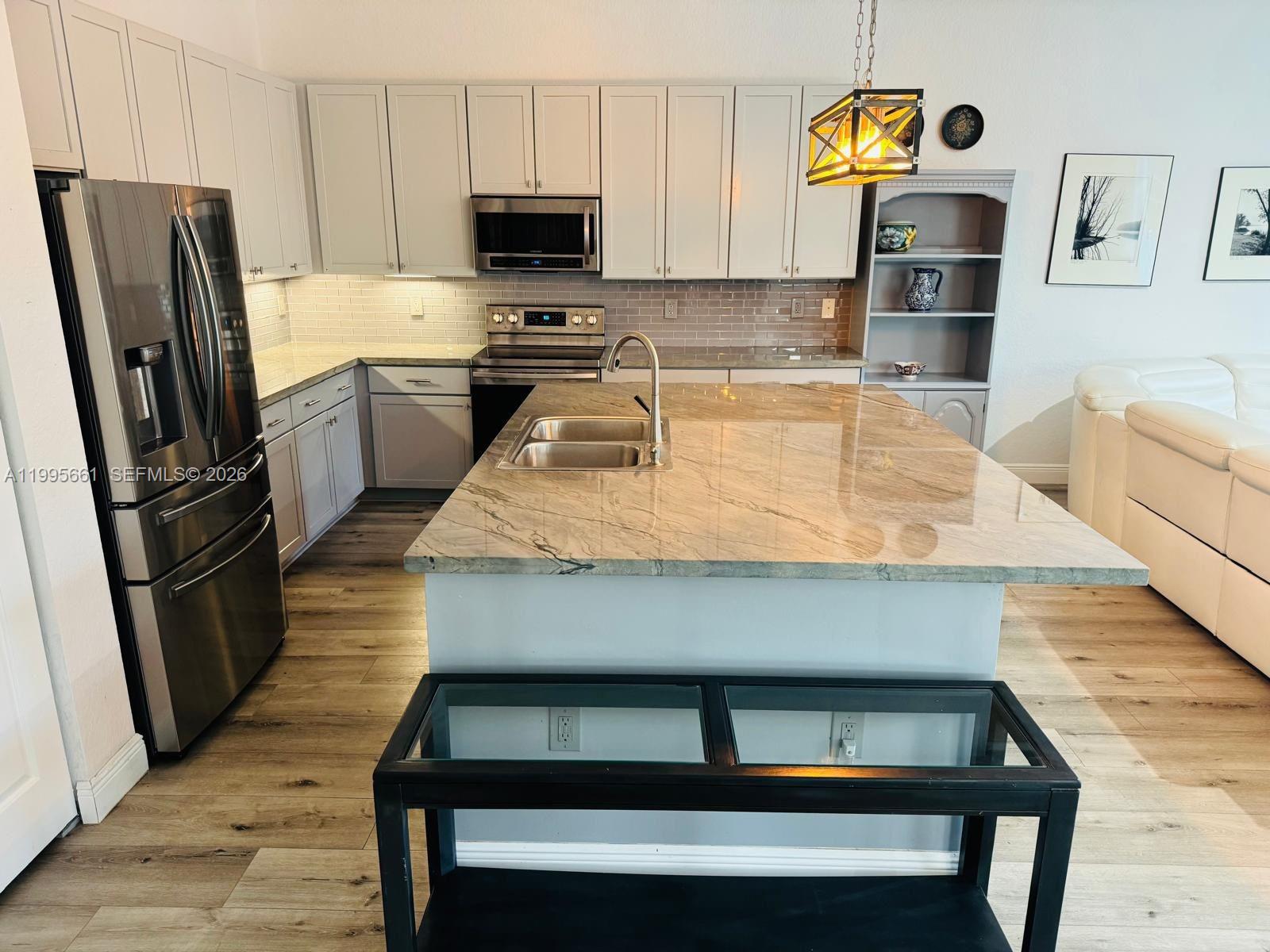 Resort-style pool and outdoor entertaining at 3041 44th St - Home in Dania Beach