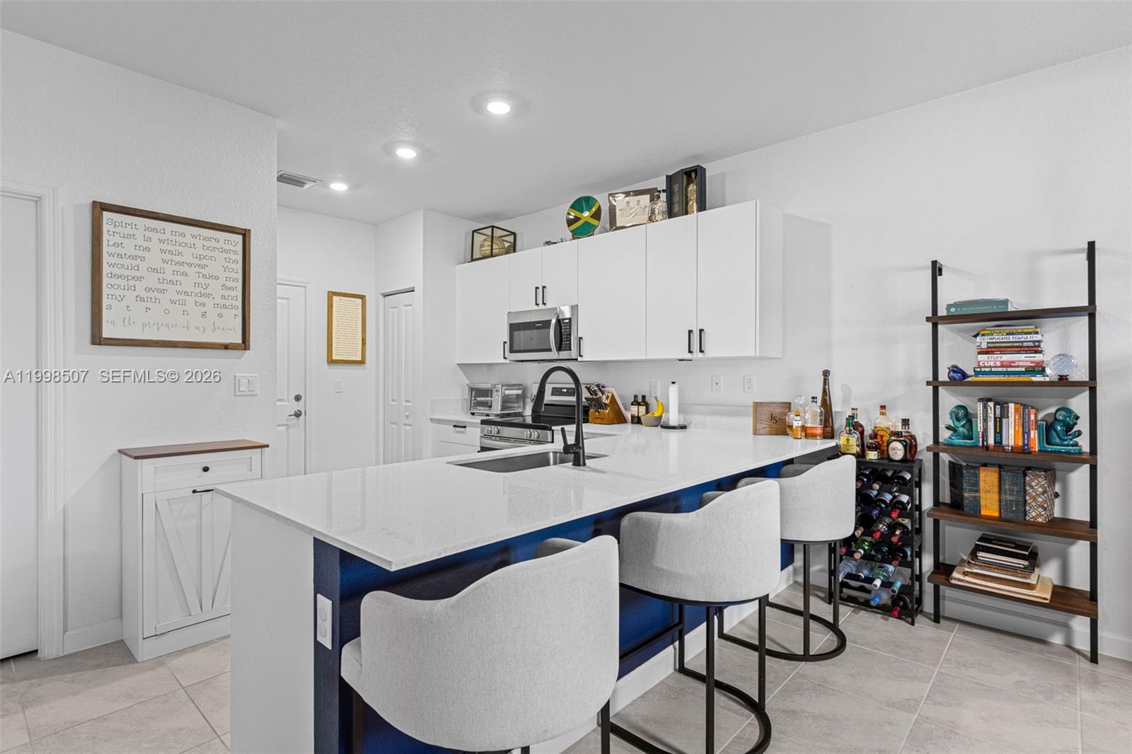 Modern kitchen with designer features at 4917 Oakmont Dr - Townhouse in Dania Beach