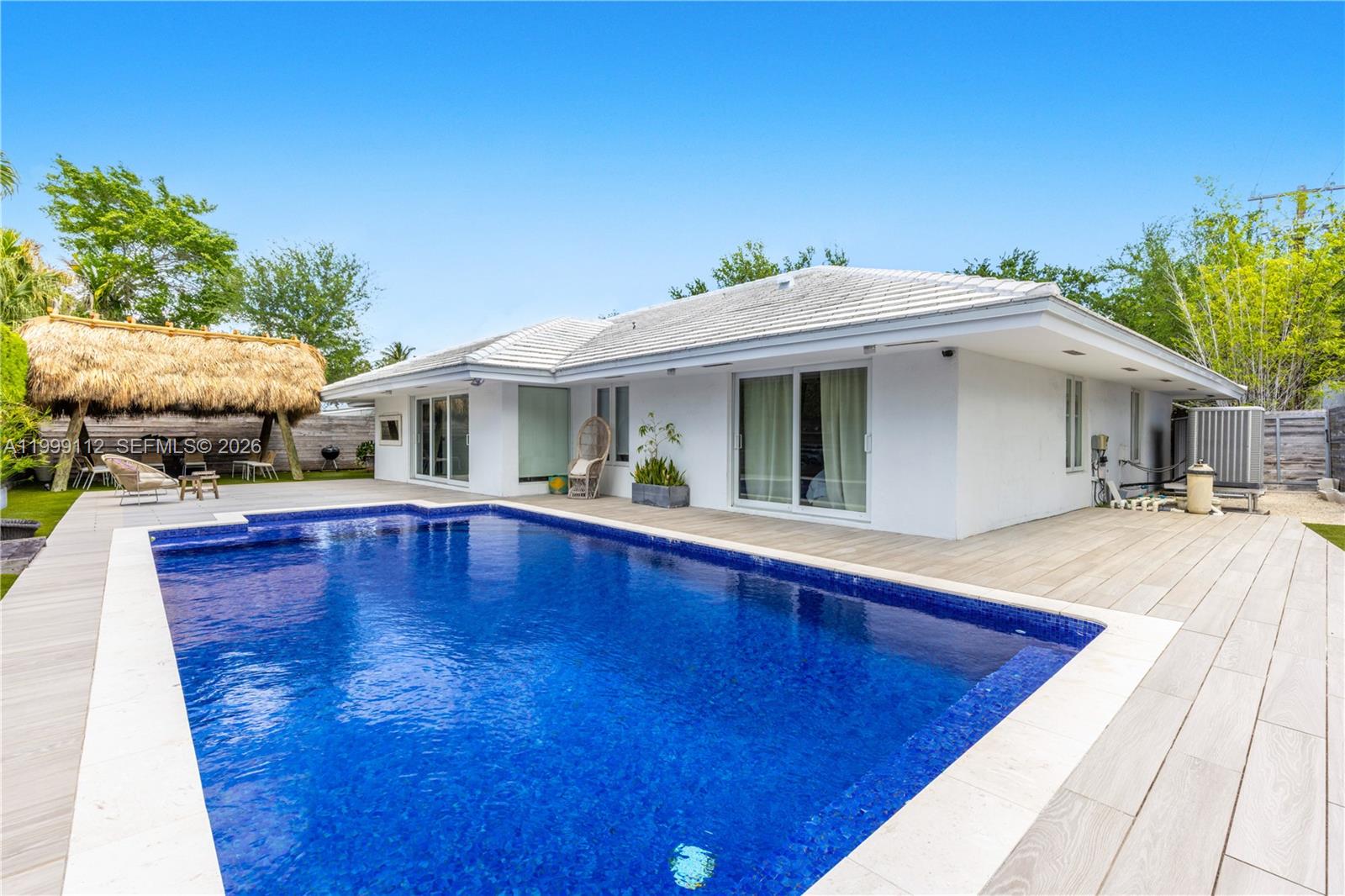 Located in one of the most exclusive residential pockets of Key Biscayne, surrounded by multi-million-dollar estates, this beautifully designed 5-bedroom, 4 full bathroom home offers the perfect balance of privacy, functionality, and tropical lifestyle.The layout is thoughtfully distributed with a private primary suite on one side, a separate nanny/guest suite with its own bathroom, and a dedicated wing for the children’s bedrooms—ideal for both family living and entertaining.Just steps from top-rated schools and only 10 minutes from the beach, the property features a stunning outdoor space with a resort-style pool and a charming tiki bar, creating the ultimate South Florida oasis.A rare opportunity to own in a highly sought-after neighborhood where surrounding homes reach $10M+.