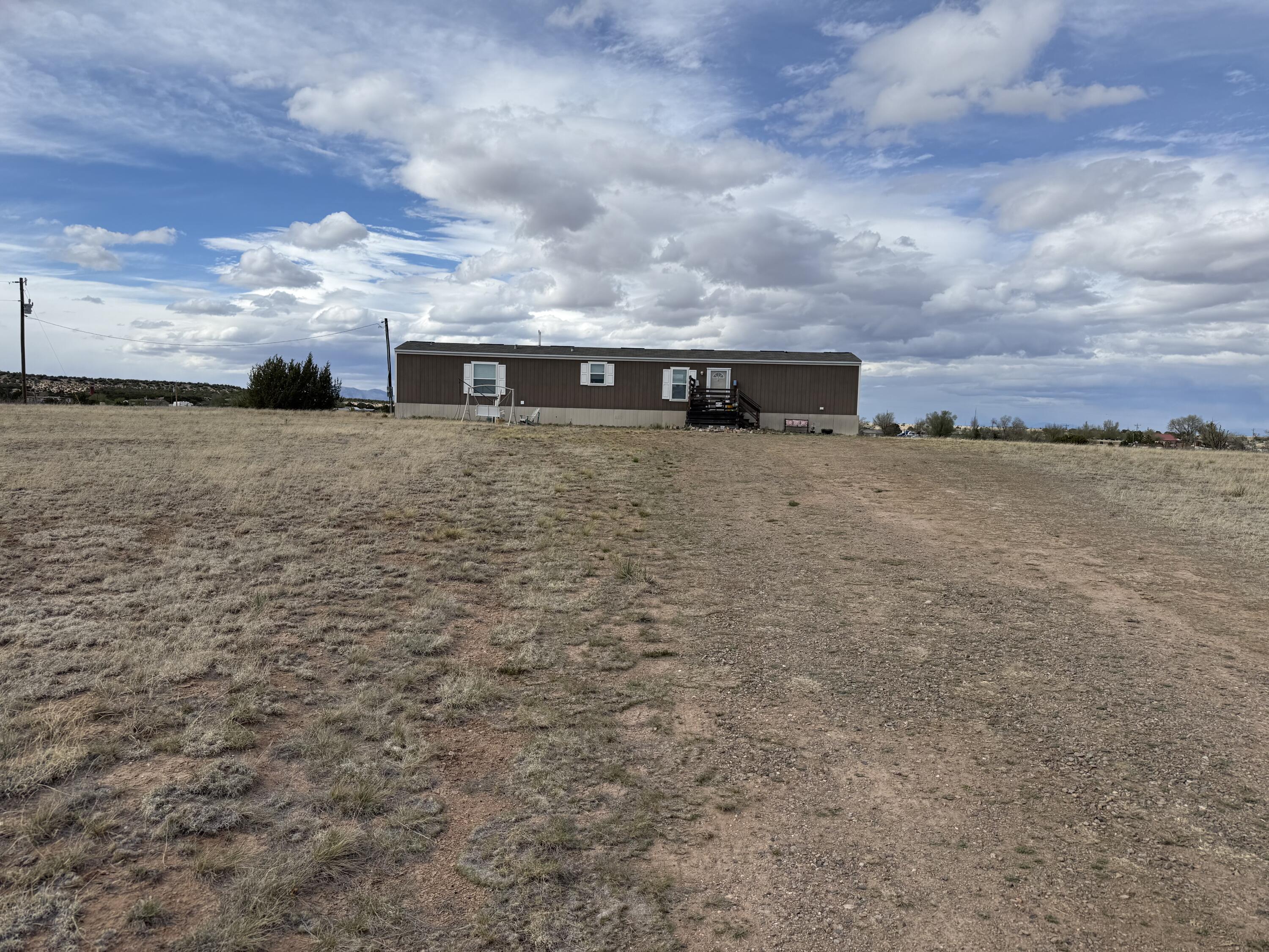 Well maintained nearly new single wide mobile home on 2 acres atop a south facing slope offering 360 views of the surrounding mountains.  Home has natural gas heat and refrigerated air cooling. Easily accessible and convenient;y located property at an affordable price.