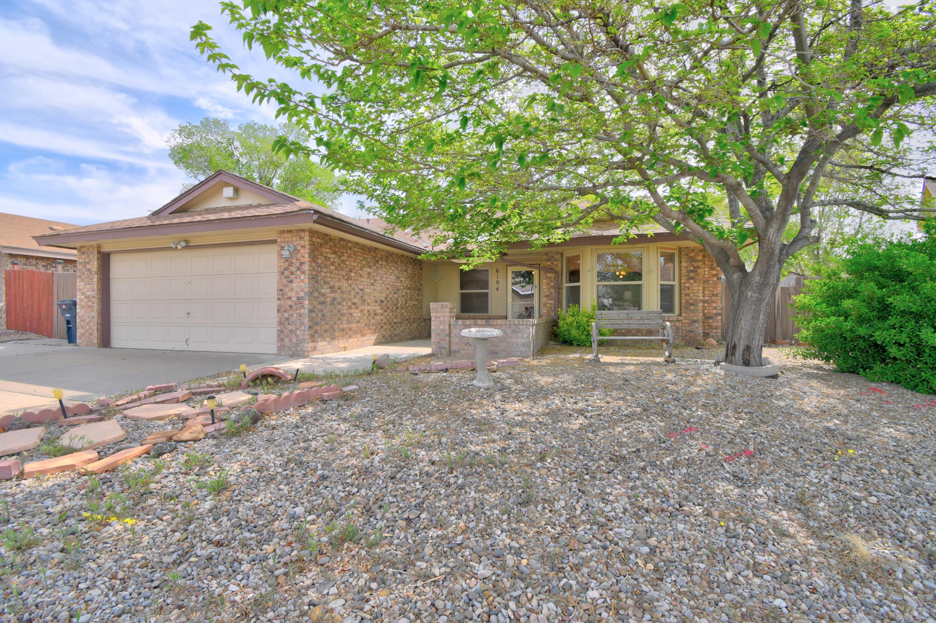 Don't miss out on this single story 3 bedroom, 2 bath home on a 0.14 acre lot, adjacent to a cul-de-sac in ABQ's NW Heights. Open floor plan with multiple living areas, high ceilings, and exposed beams. Additional features include a fireplace, skylights, and ceiling fans throughout.Living spaces connect to one large enclosed sunroom with ventilation and electricity, included in the sf. Additional side sunroom is not included in the sf. Primary suite features double door entry, dual sinks, and walk in closet. Recent updates include luxury vinyl plank flooring; most windows updated; Wagner furnace/AC unit less than 1 year old.  Spacious driveway. Shed in back. Personal property will be removed prior to showings. Price reflects current condition, including flooring considerations an