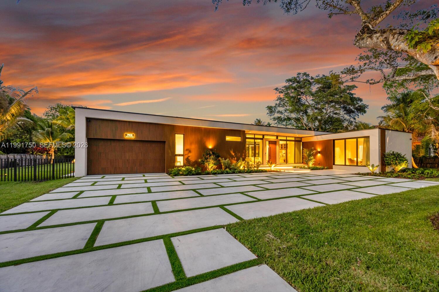 Introducing Casa Pinecrest, a striking modern estate in one of Pinecrest’s most coveted neighborhoods, set behind gates on a sprawling 37,853 sqft lot. Designed for elevated living and effortless entertaining, this residence offers a 6 bedroom, 6.5 bathroom main home plus a detached VIP suite and private gym, creating a true resort style compound with exceptional privacy.Every detail reflects exceptional craftsmanship, from custom millwork and museum finish baseboards to refined interior doors by MiaCucina. The main kitchen by Febal Casa is a showpiece, featuring Taj Mahal quartzite countertops, top of the line SubZero and Miele appliances, and an oversized pantry. A separate chef’s kitchen adds functionality, ideal for entertaining or catering.Refined finishes continue throughout with 48x48 minimal white natural travertine flooring, expansive open living areas filled with natural light, and floor to ceiling glass enhancing the indoor outdoor flow. A statement powder room in emerald green stone and a spa inspired primary bath in Islimm Geo Crema complete the design. Outdoor living impresses with a heated pool, spa, summer kitchen, and expansive entertaining spaces. A full Control4 smart home system, electric blackout curtains, impact windows and doors, and a 2 car garage complete this turnkey estate in the heart of Pinecrest, offering a rare blend of design, scale, and functionality for today’s luxury buyer, with seamless indoor outdoor living throughout.