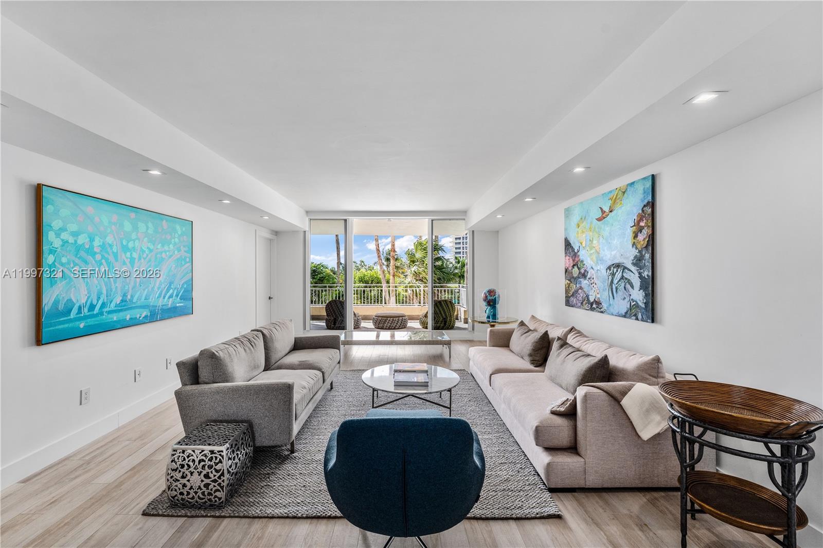 Rarely available in The Ocean Club's most desirable beachfront building, Ocean Tower Two, this 3,084 sqft residence has been reimagined from its original 3-bedroom layout into a thoughtfully designed 3-bedroom plus enclosed den, featuring a formal living room, formal dining room, family room and laundry room. Light wood-finish tiles and floor-to-ceiling sliding glass doors flood every room with natural light and ocean breezes. The spacious and luminous chef's kitchen features a center island, SubZero and Miele appliances and a separate coffee counter with wine storage area. Two spacious terraces overlook lush tropical gardens, resort pools, and the Atlantic — the perfect backdrop for everyday island living. The primary suite offers direct terrace access and a fully renovated spa bath with dual vanities, glass-enclosed shower, and soaking tub. The 2nd and 3rd bedrooms feature abundant natural light and fully renovated bathrooms, while the enclosed den is an ideal space for a home office or 4th bedroom. The Ocean Club provides luxurious resort-style living: beach, pools, restaurants, fitness center with ocean views, spa, salon, playground, playrooms, 7 Har-Tru tennis courts, 3 padel courts, security and valet services. Beyond the building, enjoy the relaxed, walkable lifestyle of Key Biscayne — a true island village with world-class parks, beaches, dining, and a close-knit community just minutes from downtown Miami.