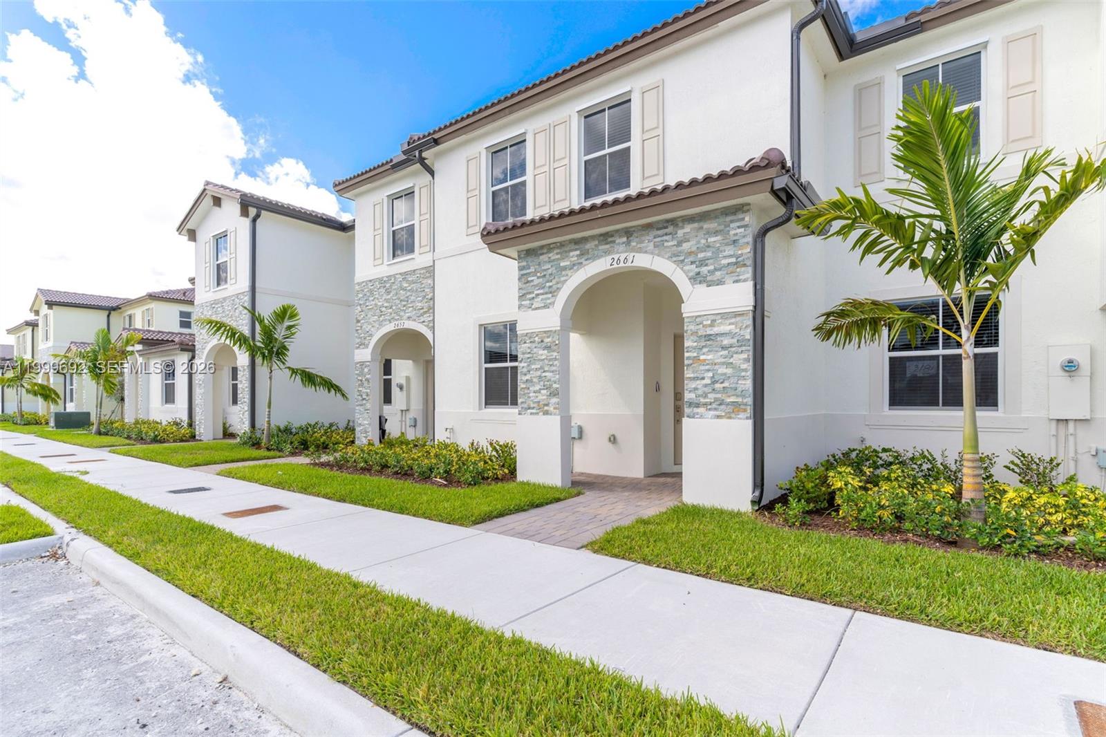 New Construction two-story townhouse boasts three spacious bedrooms, two full bathrooms, and a half-bath. The open layout features a family room, dining area, and kitchen, along with a separate living room for additional relaxation and entertainment space. All bedrooms are conveniently located on the second floor. The kitchen is outfitted with stainless steel appliances, quartz countertops, and ample cabinet storage. A large, fenced patio provides the perfect spot for unwinding or hosting guests. Ideally situated near schools, Turnpike Exit 2, shops, restaurants, a hospital, the Amazon Distribution Center, and Homestead Air Base.