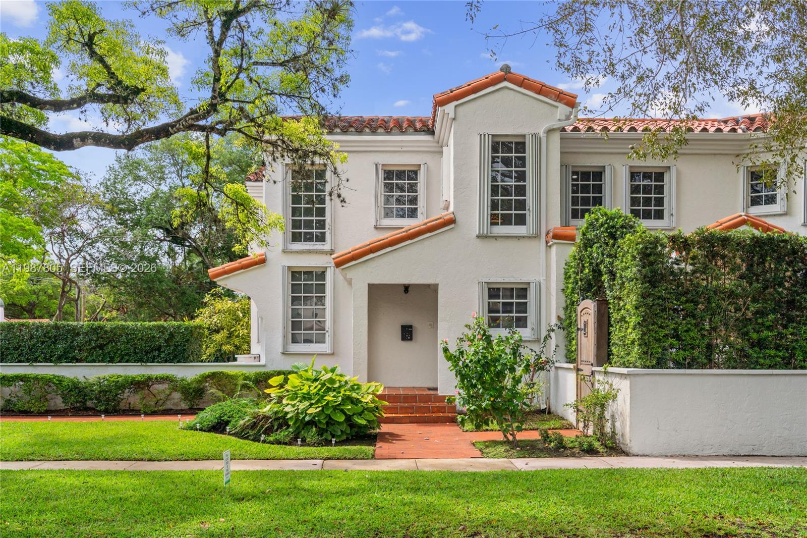 This stunning two-story corner home blends elegance, comfort, and value. Soaring vaulted ceilings and a seamless layout connect the living, dining, gourmet kitchen, and family room—ideal for entertaining and everyday living. The first floor features a bedroom and full bath, plus a heated saltwater pool, outdoor shower, fireplace, and spacious garage. Upstairs offers three bedrooms, including a beautifully renovated primary suite. Filled with natural light, this Spanish-style residence is in the heart of Coral Gables, just steps from Granada Golf Course and minutes from the Biltmore Hotel, Salvadore Park, and the Venetian Pool. Schedule your private tour today!