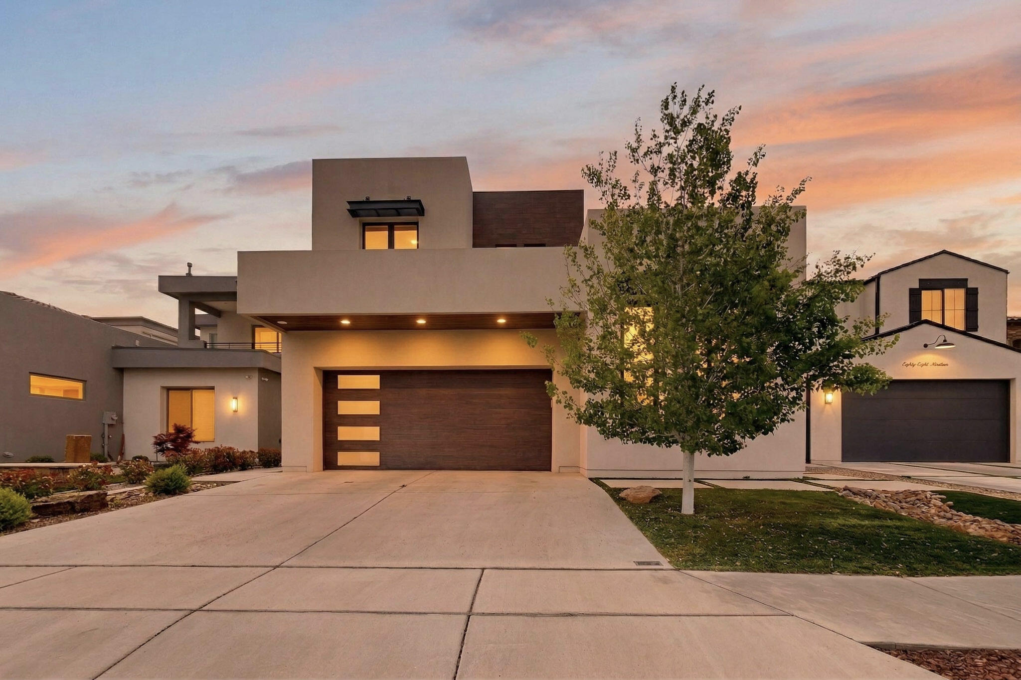 Discover this stunning 4-bedroom, 4-bathroom contemporary home in the highly desirable Silver Oak Estates. Designed with both luxury and functionality in mind, this residence showcases sophisticated architecture, clean lines, and premium finishes throughout. The light-filled open floor plan creates a seamless flow, perfect for both everyday living and entertaining. A rare 4-car tandem/split garage offers exceptional versatility, ideal for multiple vehicles, a home gym, or additional storage. The spacious laundry suite is designed with double washers and dryers. Enjoy modern conveniences throughout the home, including mounted televisions, motorized blinds, central vacuum system, and expansive 8-foot doors. Step outside to your private backyard retreat, complete with a hot tub and deck.