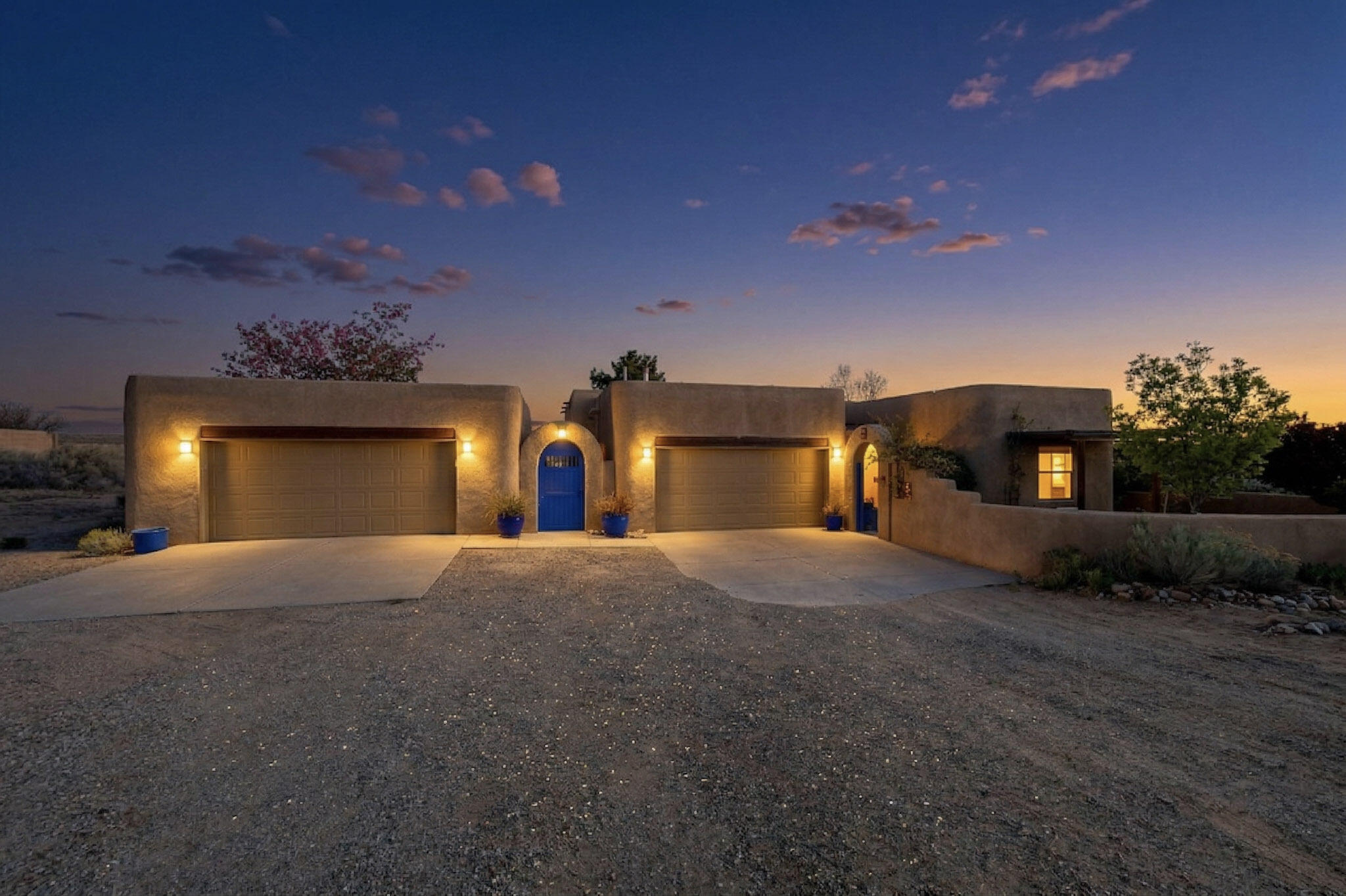 Welcome home to this exceptional Southwestern-style property in Rio Rancho's desirable Chamiza Estates, offering breathtaking panoramic views, privacy, on 1.1 acres of land. This move in ready, single-story home includes an additional 1.09 acre parcel to the east (UPC 1014071315217- address 4521 Huron Dr NE), bringing the total acreage to 2.19 and providing  E-1 horse zoning.The 2,181 square foot floor plan features 3 bedrooms, 2 bathrooms, vaulted ceilings, lit nichos, and an open-concept layout filled with natural light and stunning vistas from every angle. A large great room centers around a cozy gas fireplace, flowing seamlessly into the chef's kitchen--updated with colorful cabinetry, stainless steel appliances, quartz countertops, MORE