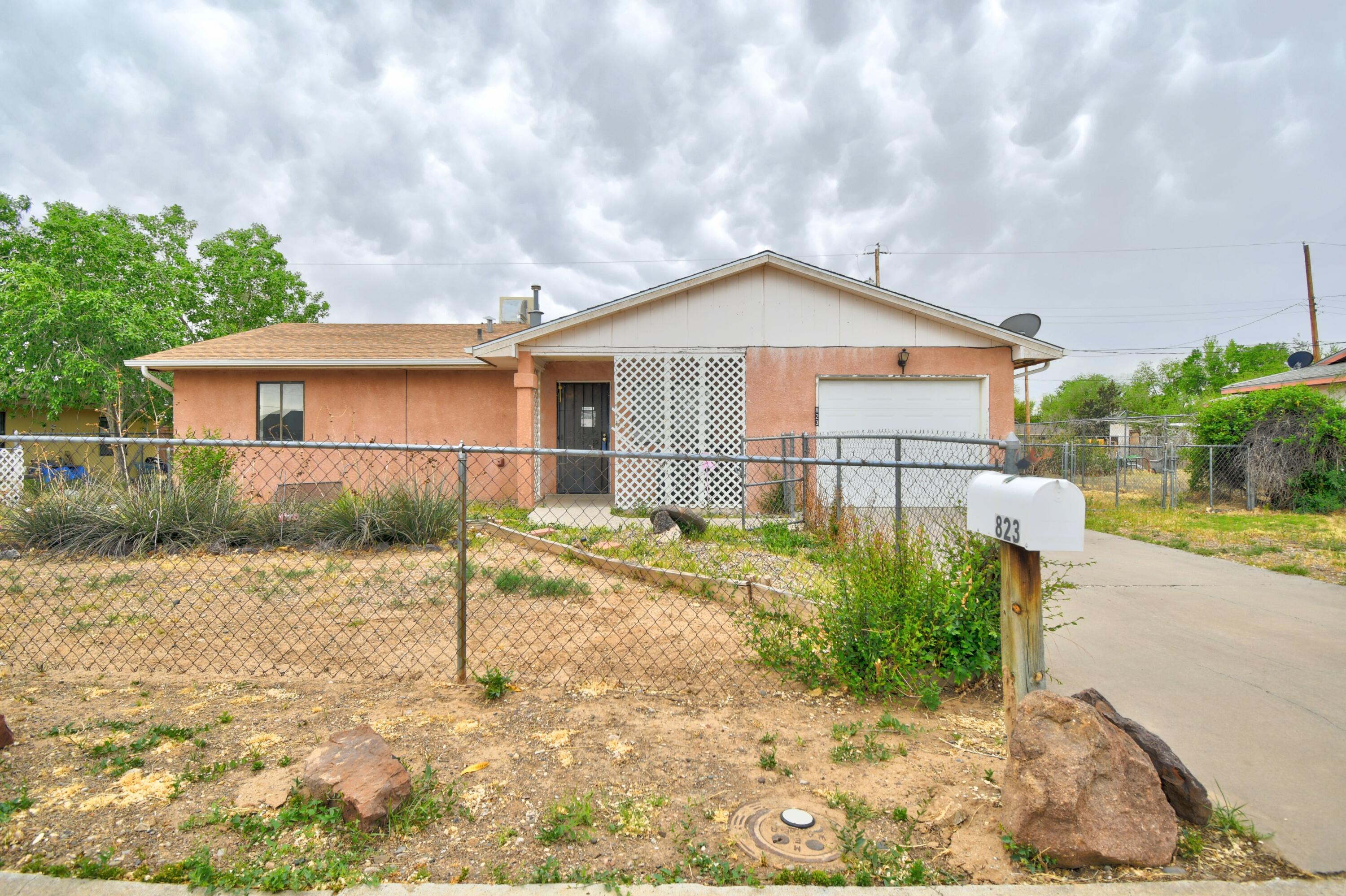 Don't miss your opportunity on this 3 Bedroom, 1 bath home in a developed neighborhood. Large backyard with access for many possibilities. Large living room with attached dining room have laminate wood flooring, kitchen, utility room and bathroom have tile floors. Central Forced air with evaporative cooler. Covered front patio to enjoy the shade and outdoors. Home is being sold as is no repairs to be made.