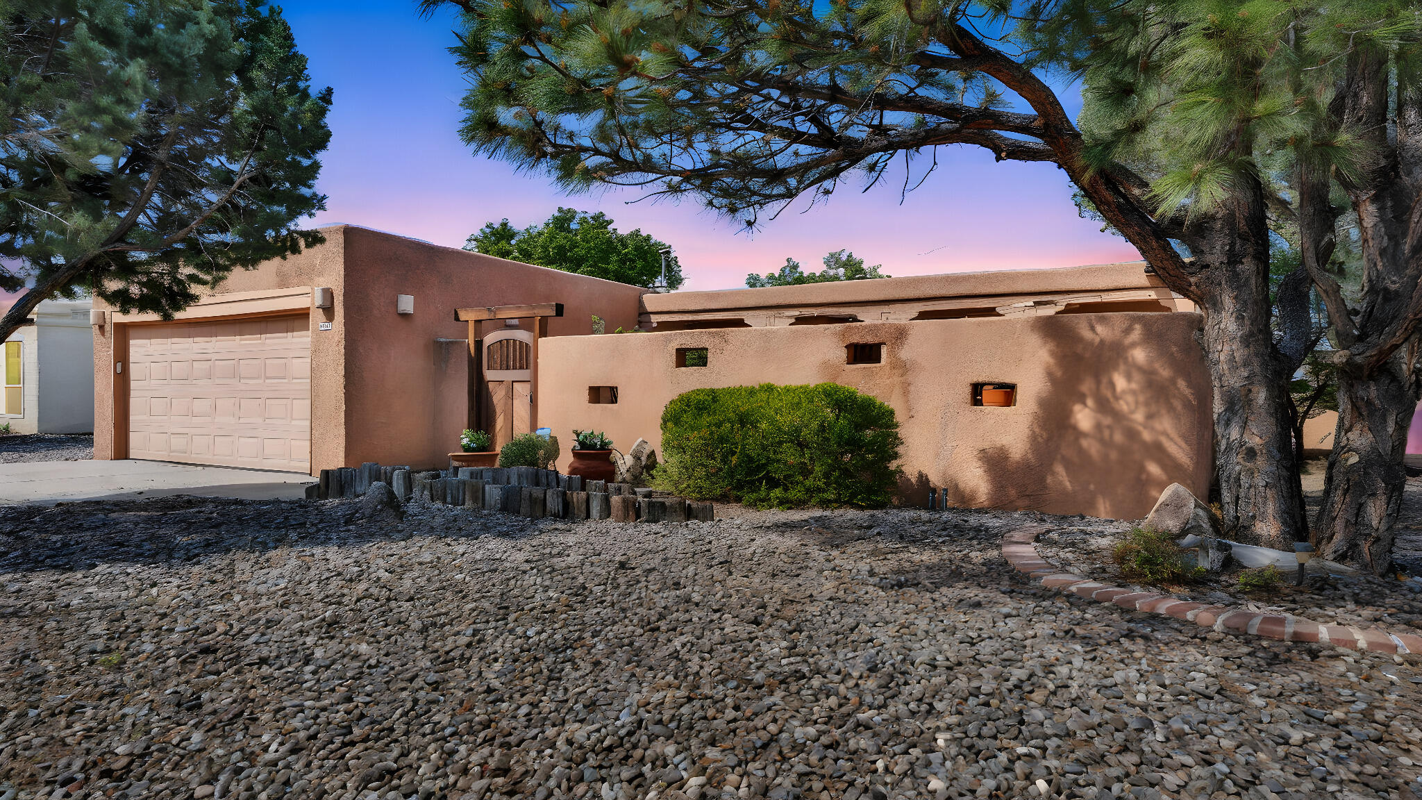 Nestled at the base of the Sandia Mountains, this one-of-a-kind foothills home offers an unbeatable blend of location, updates, and value. Fully renovated and meticulously maintained, it features a private enclosed front courtyard with a serene water feature and an immaculate backyard perfect for hosting.Located in a highly desirable neighborhood just moments from Sandia trails and parks, this is a rare opportunity to own something truly special at this price point.Homes like this don't come around often--don't miss your chance.