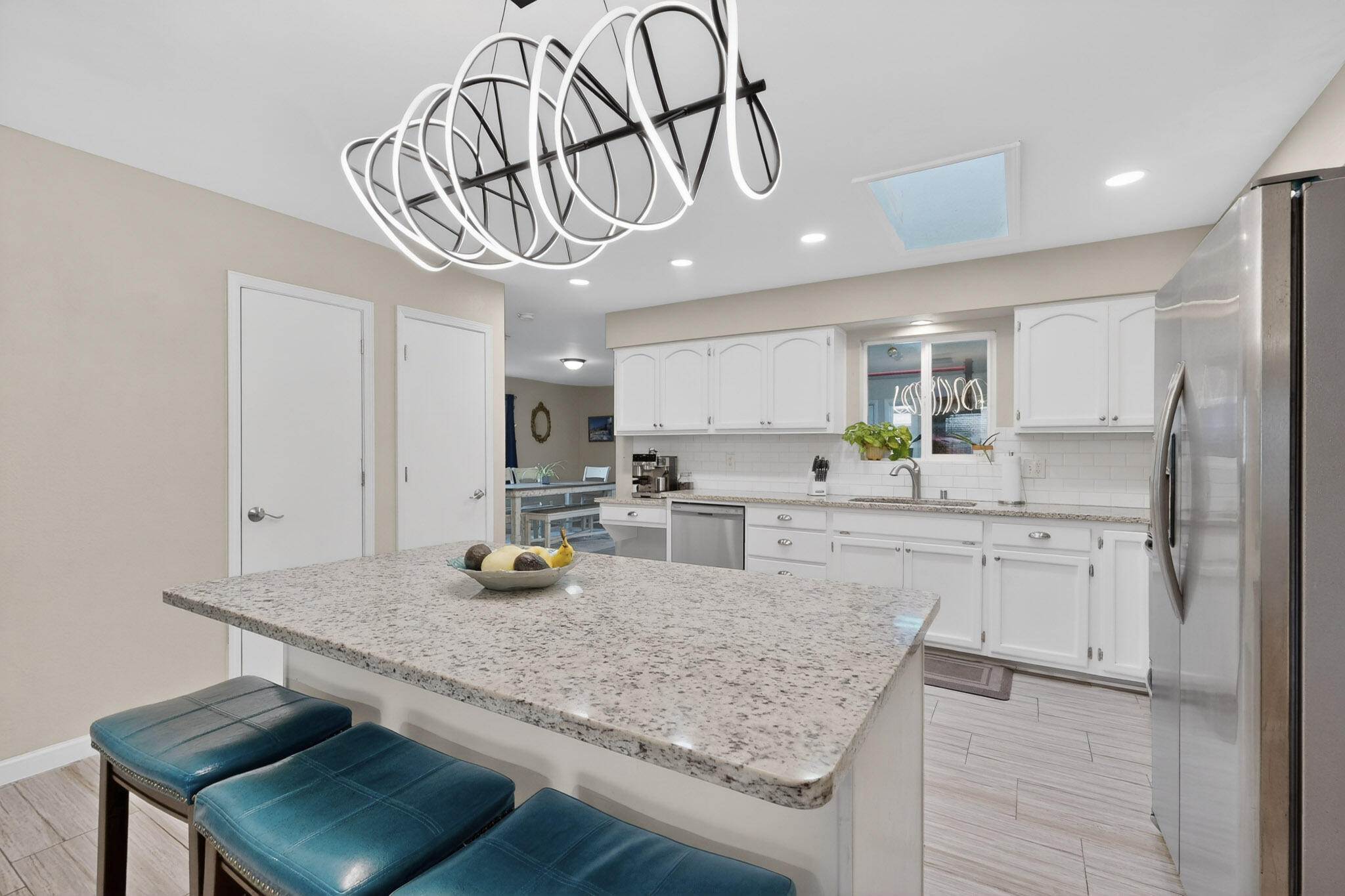 Stunning, updated home in Albuquerque's convenient NE Heights!  Step inside to discover modern upgrades-newer flooring and windows and fresh paint. Sunlight streaming in to create a fun, cheerful atmosphere. The kitchen offers a large central island, granite counter tops, sleek stainless-steel appliances, and stylish contemporary colors. Beautifully landscaped yard, offering a serene setting for relaxation or flipping burgers with your friends. Wonderful, detached patio, with its welcoming vibe. Possible RV parking.  Thoughtful updates, make this home cozy & inviting. Living here means enjoying easy access to all of the local amenities such as Starbucks, The Range, Target and Naturals Grocers. Come check it out and fall in love!
