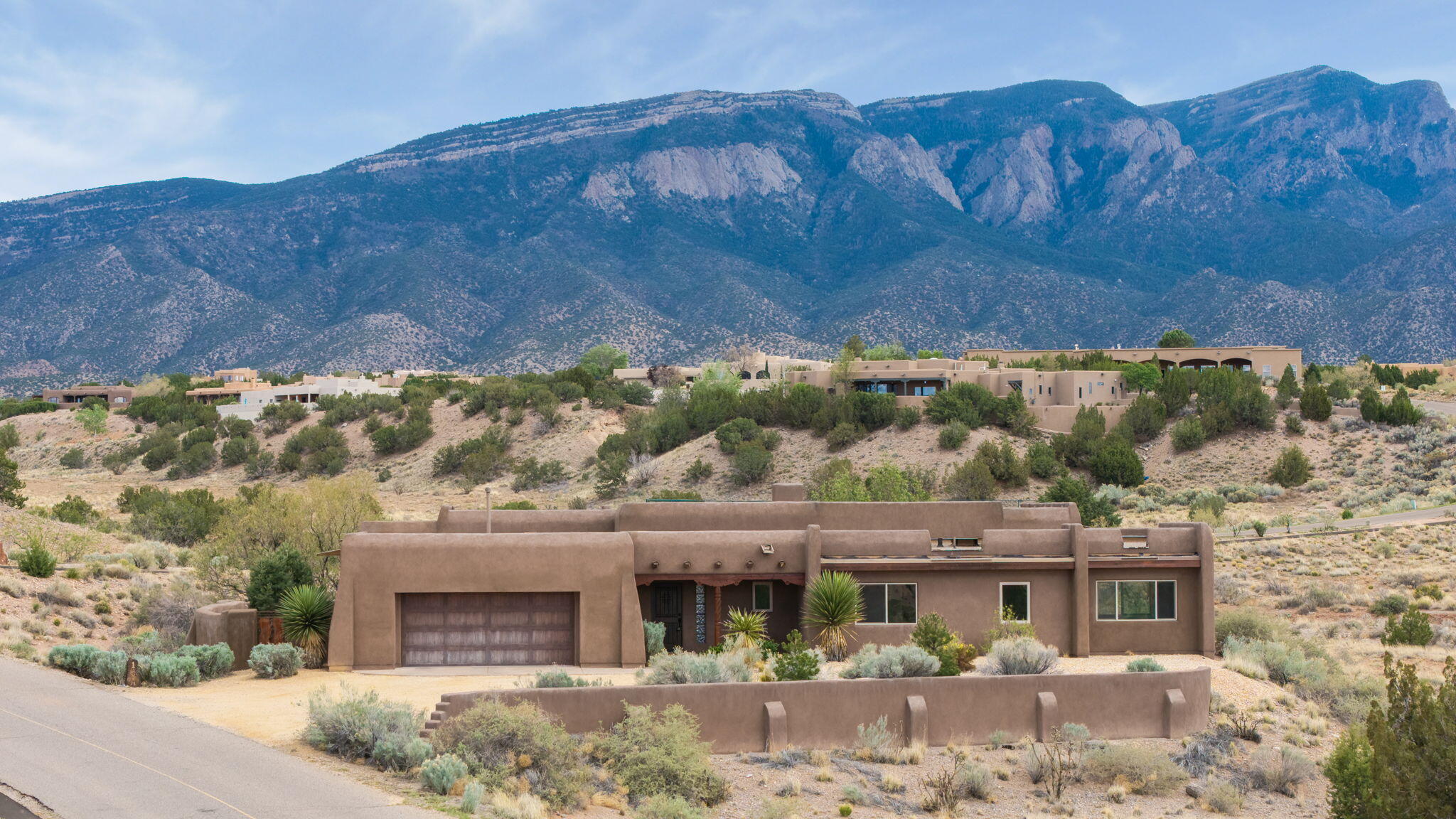 This is exactly the Placitas homestead you've always dreamed of. An oversized lot offers extra space as well as insurance for the breathtaking views of the Sandias. Nothing will block your view as you watch the serene landscape go by through the huge picture windows. Built by one of the area's most renowned creatives, Tom Ashe, the opportunity to own a piece of Placitas history is yours for the taking. The craftsmanship in this home can be felt even more than seen. From the diamond plaster detail to the thoughtful wood features, you won't feel this way anywhere else. In one of the most convenient locations in town: across the street from the community tennis court, 3 minutes to Placitas' grocery and restaurant hub, and 5 minutes to I-25. Schedule your private showing today!