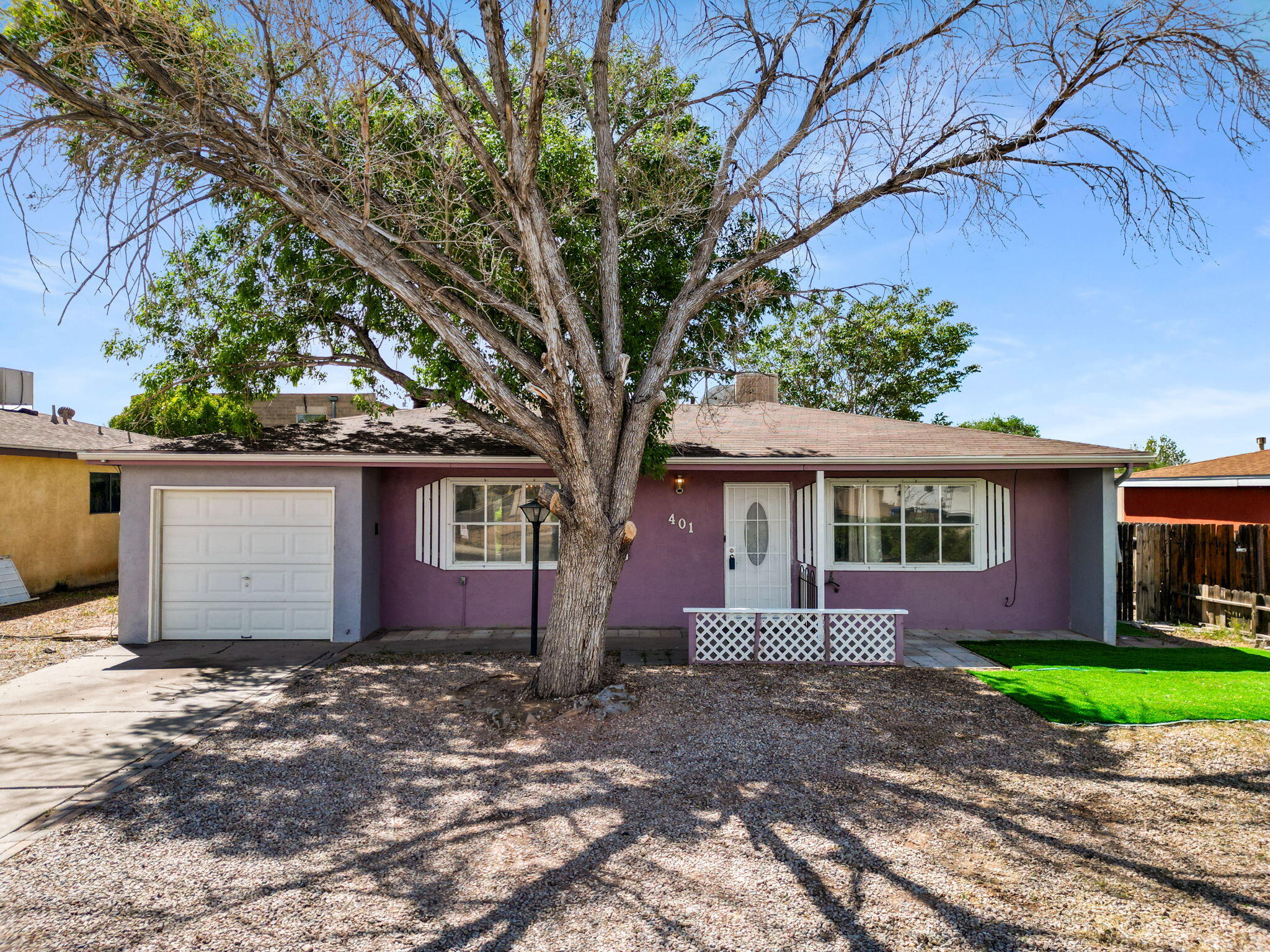 Take in breathtaking, unobstructed Sandia Mountain views from this warm and well-cared for 3 bed, 2 bath home. Step inside to a bright, open great room w/ a flexible layout for both living & dining. Natural light fills the space, creating a comfortable & inviting feel. The spacious kitchen offers ample cabinetry & room to gather. A heated sunroom adds year-round living space - perfect for relaxing, hobbies, or a home office. The large, fully fenced backyard offers a private setting w/ a covered patio, storage shed, & plenty of room to garden, entertain, or add outdoor amenities. Updates completed since ownership include appliances, water heater, swamp cooler, & flooring in two of the bedrooms. Conveniently located w/ easy access to I-40, Sandia Labs, KAFB, plus nearby shopping and dining!