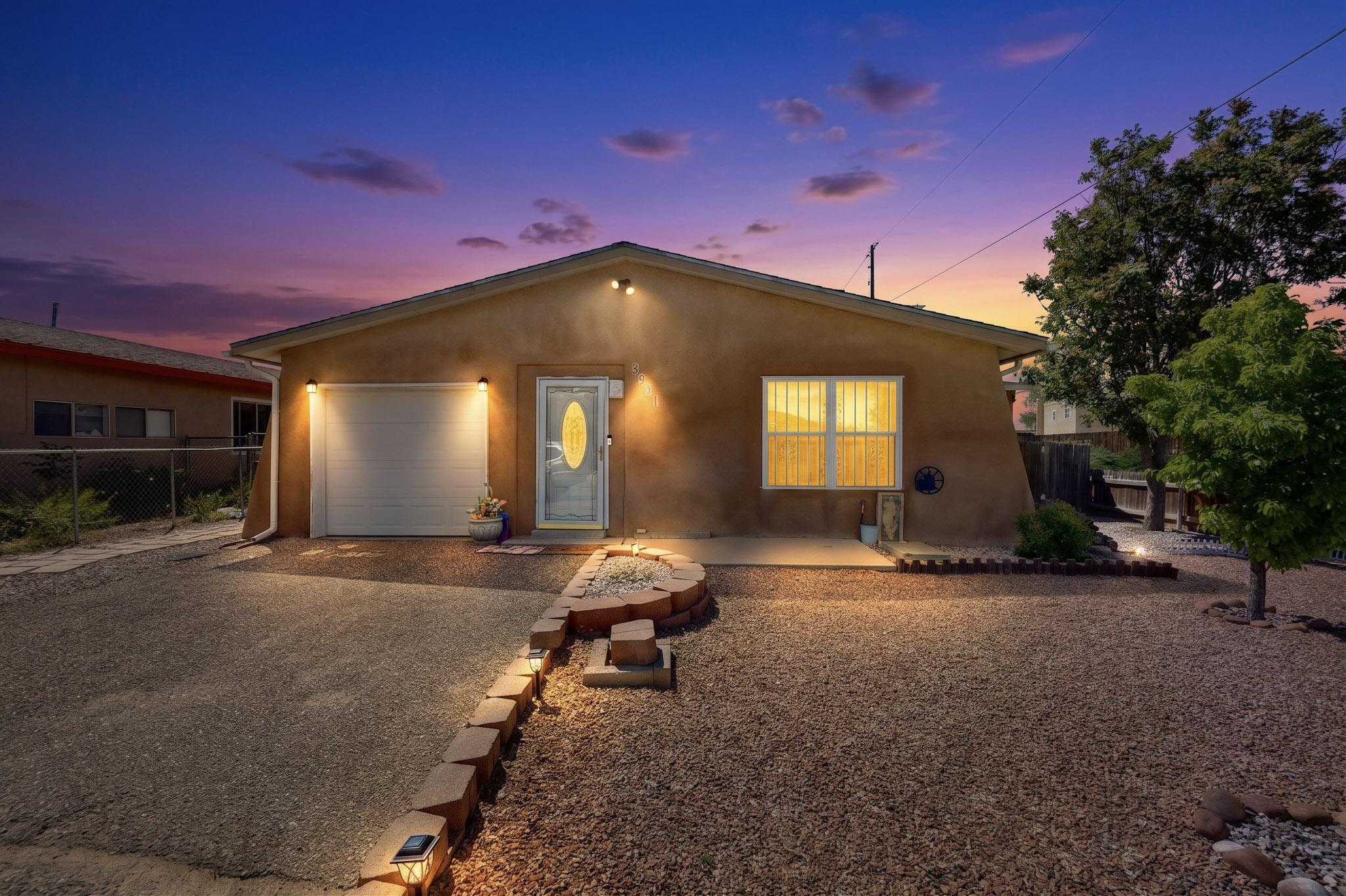 Discover this charming gem, nestled on a prime corner cul-de-sac lot. This home boasts an inviting, open floor plan with a mix of tile, laminate, and warm wood flooring--no carpet here! Featuring an open kitchen with stunning cabinetry, flowing seamlessly into a bright living room complete with a cozy nook. Retreat to a generous primary suite, while updated vanities and fixtures add a modern touch to every bath. Appliances include a Stove, fridge, washer, dryer, and garage freezer stay! Additional features include Ceiling fans throughout, a covered back patio, plus secure wrought iron and storm doors, easy-care gravel landscaping with mature trees and potential backyard access. Minutes from shopping, dining, top-rated Rio Rancho schools, plus Sabana Heights and Roadrunner Parks.