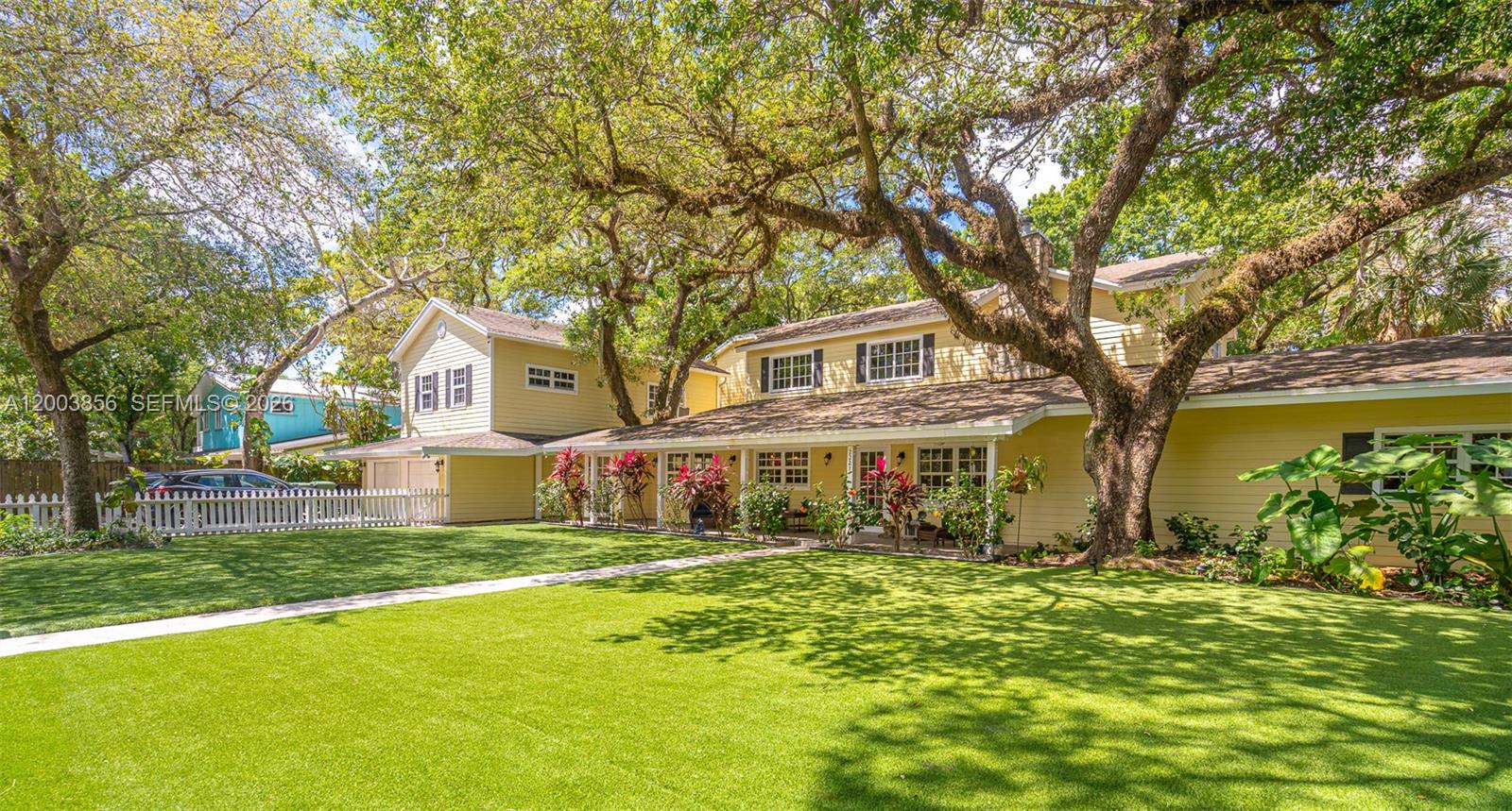 A truly one-of-a-kind custom estate that feels transported from the Carolinas or Tennessee, this exceptional country-inspired residence offers warmth, character, and refined craftsmanship in the heart of Fort Lauderdale.Set on an expansive 26,598 sq ft lot, this private retreat welcomes you with a classic oversized front porch—perfect for relaxing and taking in the serene surroundings. The main residence spans approximately 5,775 sq ft and features 6 bedrooms and 5.5 bathrooms, thoughtfully designed for both everyday living and entertaining.Inside, a grand open-concept kitchen anchors the home, appointed with rich granite countertops, premium appliances including Sub-Zero refrigeration and a Five-Star gas range, dual sinks, and custom finishes throughout. The home showcases Chicago brick flooring, wood and tile accents, recessed lighting, and soaring vaulted and 9+ foot ceilings that enhance the sense of space and light. A spacious family room doubles as an ideal entertaining space.The primary suite is a private retreat, offering a generous 17x16 layout with a screened-in patio, along with a luxurious bath featuring a large glass-enclosed shower, Jacuzzi tub, and dual vanities.Above the garage, a separate 850 sq ft guest/in-law suite includes a full bedroom, bathroom, and kitchenette—perfect for extended family or guests.Outdoors, the property truly shines with ample space for boats, cars, RVs, and more—an incredibly rare find in this prime location.