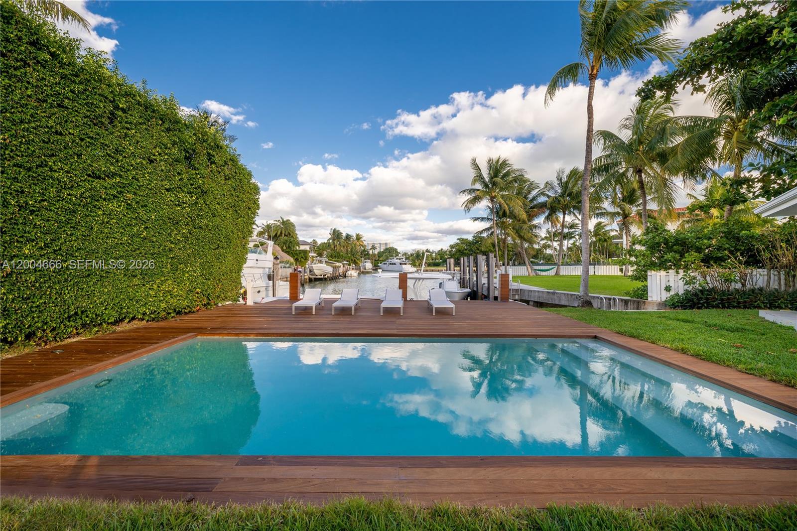 welcome to Key Biscayne. You cannot dream of a most perfect home with only good vibes and a twist of Saint Barth One story Beach house home style, with 5 bedrooms. Open kitchen, large reception area and inviting covered terrace overlooking pool and gazebo . Light grey color floors, open kitchen with countertop overlooking garden and pool. Perfectly appointed and elegant decoration. Family room, formal dining, 3 bedrooms on left wing of the house and 2 additional bedrooms on right wing of the house. Laundry area. Staff quarter. Cabana bath. Family, guests and friends adore to spend quality time in this unique home. Circular driveway .Please call for additional pictures