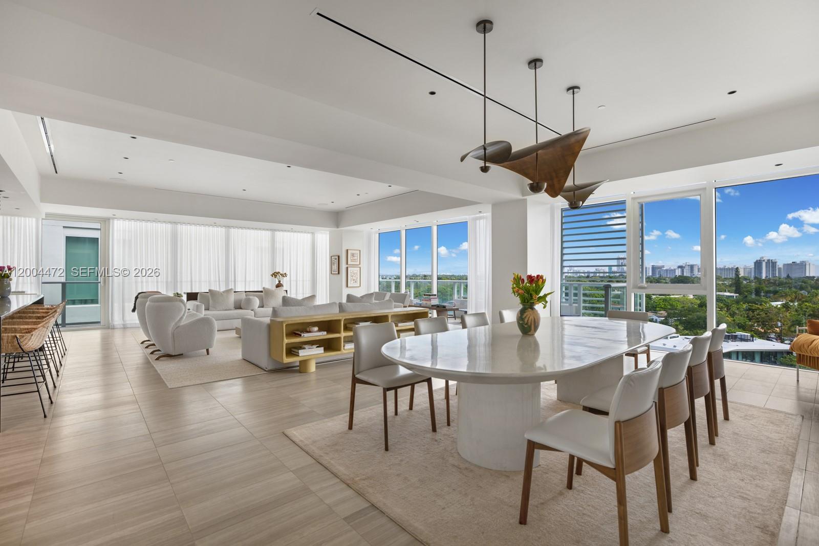 Elevated waterfront living at The Ritz-Carlton Residences, Miami Beach. Piero Lissoni's acclaimed seven-acre enclave on Surprise Lake. Residence 627 is a light-filled 3-bedroom + den, 3.5-bath home with an expansive open floor plan, floor-to-ceiling glass, 10-foot ceilings, and a private wraparound terrace that invites seamless indoor-outdoor living. The chef's kitchen features custom Boffi cabinetry, honed stone countertops, and fully integrated Gaggenau appliances, flowing effortlessly into the dining and great room. The serene primary suite offers a spa-inspired bath with dual vanities, deep soaking tub, frameless glass rain shower, and generous walk-in closets. Two additional en-suite bedrooms, each with its own designer bath, plus a versatile den, ideal as a home office, media room, or guest suite, complete the thoughtfully designed layout. A dedicated laundry room and elegant powder bath round out the home.Ownership delivers an unmatched five-star lifestyle: 36 private boat slips, resort-style pool with cabanas, full-service spa, state-of-the-art fitness center, residents-only dining room and wine cellar, 24-hour concierge, valet, security, and a dedicated on-site art curator. Set within lushly landscaped grounds moments from the beach, Bal Harbour Shops, Sunset Harbour, Lincoln Road, and Miami's premier dining and cultural destinations. A rare opportunity to own in one of Miami Beach's most coveted addresses.