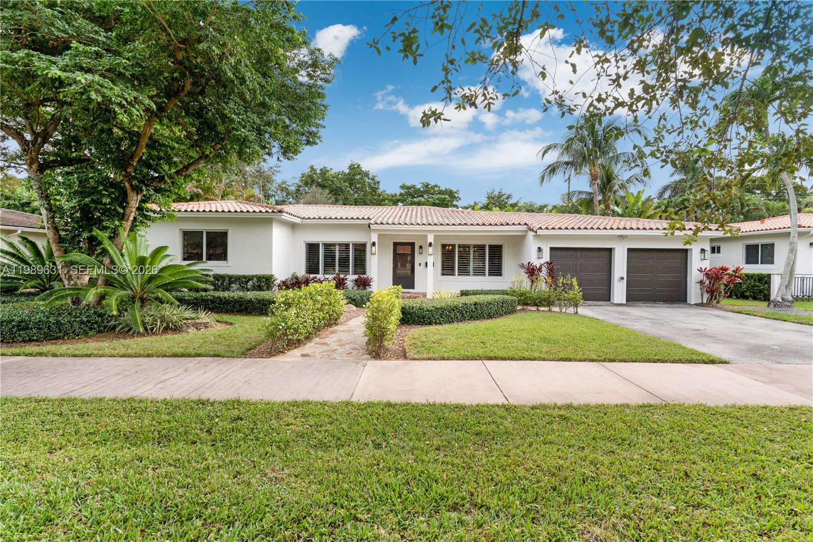 Magazine quality designed house in prime South Gables location completely renovated in 2021 with tall vaulted ceilings, an open split floor plan and a huge master suite (expanded in 2013) overlooking a serene and peaceful pool area. This house is perfect for entertaining: the new kitchen has exquisite design including bespoke wood cabinets, a subzero fridge, a gas range and a beautiful quartzite island with lots of storage. It also has a custom bar area with antique mirror and wine fridge. The home has a full outdoor summer kitchen. Large size Italian porcelain floors, 2 A/C zones, 2 water heaters, impact windows throughout, top of the line double garage doors, new plumbing, new electrical panel and wiring, new drain-field and a gym bonus room. Close to UM, top schools and fine dining.