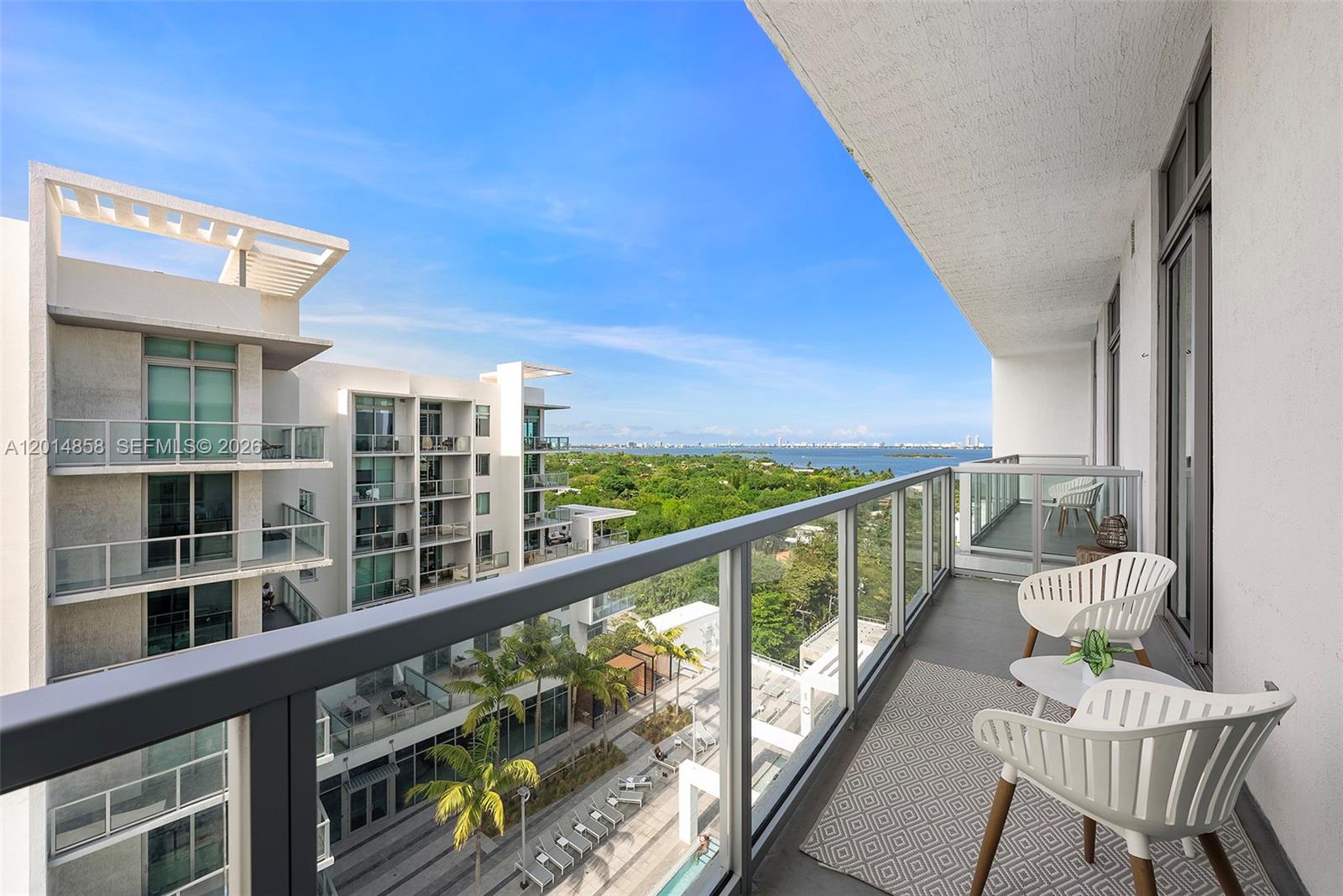 Exceptional penthouse residence at Quadro offering the perfect blend of lifestyle and investment potential in the heart of Miami’s Design District. This beautifully furnished 1-bedroom + den features an open-concept layout, floor-to-ceiling windows, and a private balcony with partial bay views.The residence comes beautifully furnished, including Italian cabinetry, quartz counters, and porcelain floors, complemented by an in-unit washer and dryer. Whether used as a personal Miami retreat or an income-producing property, Quadro’s Airbnb-friendly policy with a 3-night minimum provides rare flexibility for owners seeking both enjoyment and strong short-term rental potential.Residents enjoy resort-style amenities including a pool, fitness center, BBQ area, business lounge, air-conditioned bike storage, pet spa, EV charging stations, and one assigned parking space. Located steps from world-class shopping, dining, art galleries, and entertainment, Quadro places owners in one of Miami’s most dynamic and walkable neighborhoods, with easy access to Wynwood, Midtown, Miami Beach, and the airport.