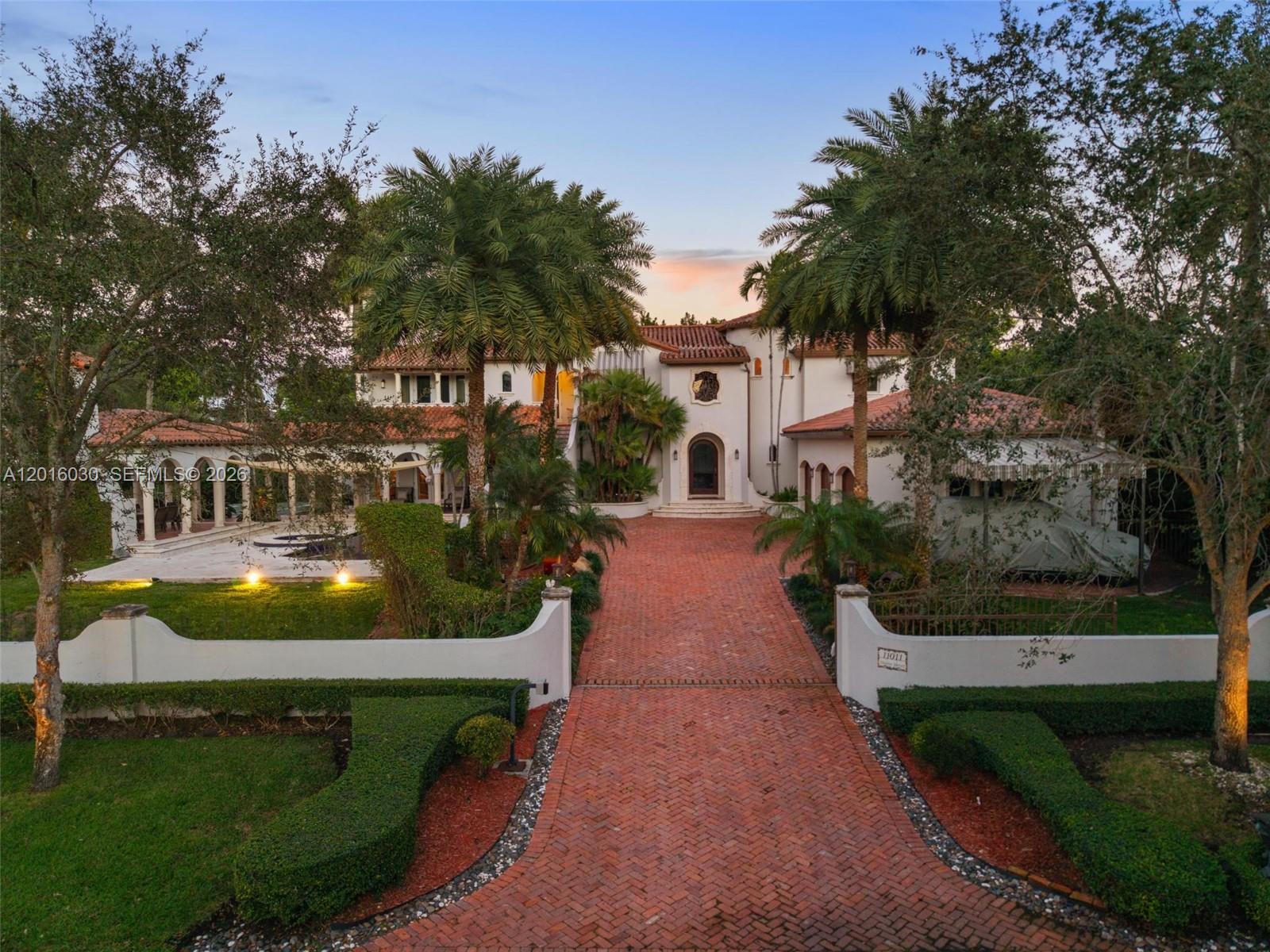 BOATER’S DREAM IN EXCLUSIVE HAMMOCK OAKS! Rare opportunity to own a Spanish-inspired estate with double boat slips and a private 75-foot dock equipped with water and electric, offering direct ocean access to Biscayne Bay within minutes. A truly unique offering for boating enthusiasts seeking the ultimate South Florida waterfront lifestyle in a prestigious guard-gated community.Additional highlights include a three-car garage with hydronic car lift, additional covered parking, central vacuum system, permanent whole-house commercial-grade Generac generator with automatic transfer switch, and a mosquito repellent system for year-round outdoor enjoyment.Designed for luxury living and sophisticated entertaining, the home showcases soaring ceilings, marble and wood flooring, intricate millwork, and handcrafted stone and tile accents throughout. A chef’s kitchen with top-of-the-line appliances flows seamlessly into expansive family and media rooms, while the custom bar area with designer ice machine elevates the entertainment experience.Outdoors, lush tropical landscaping surrounds a resort-style pool and expansive entertainment areas, including a covered gazebo with built-in grill, half-court basketball and sports court.