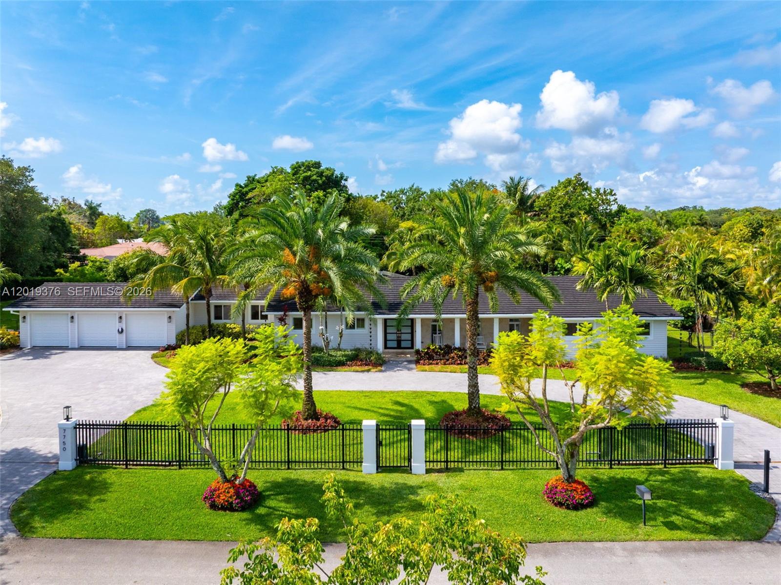Stunning 6-bed/4.5-bath house in the heart of Pinecrest, completely rebuilt in 2019 on an expansive 38,027 sq. ft. lot. This exceptional home features a saltwater pool, a chef's outdoor kitchen, a custom playhouse, and mature fruit trees — all with extra room to add a tennis, soccer, or basketball court. Inside, the primary suite overlooks the pool and boasts a spacious walk-in closet and a spa-style bath with double sinks, a soaking tub, and shower. The kitchen features a large cooking island perfect for entertaining, Kitchen-Aid fridge and built-in ovens, microwave, and dishwasher. Enjoy freshly polished floors, custom built-in closets, motorized blackout shades, and a wet bar with ice machine and wine cooler, while the Aroma 360 whole-home HVAC diffuser adds a refined touch throughout. The air-conditioned garage gym is outfitted with a professional-grade Jacked Up all-in-one system including a functional trainer, full-length mirrors, and rubber flooring — plus a Tesla charger and second EV charging station. Powered by solar panels and four Tesla Powerwalls at ~$100/month, with updated plumbing, electrical, a 2019 roof, and a whole-home Ring and Abode security system. Living in Pinecrest offers an upscale lifestyle with lush, tree-lined streets, top-rated schools, and convenient access to Miami’s shopping, dining, cultural attractions, and outdoor recreation.