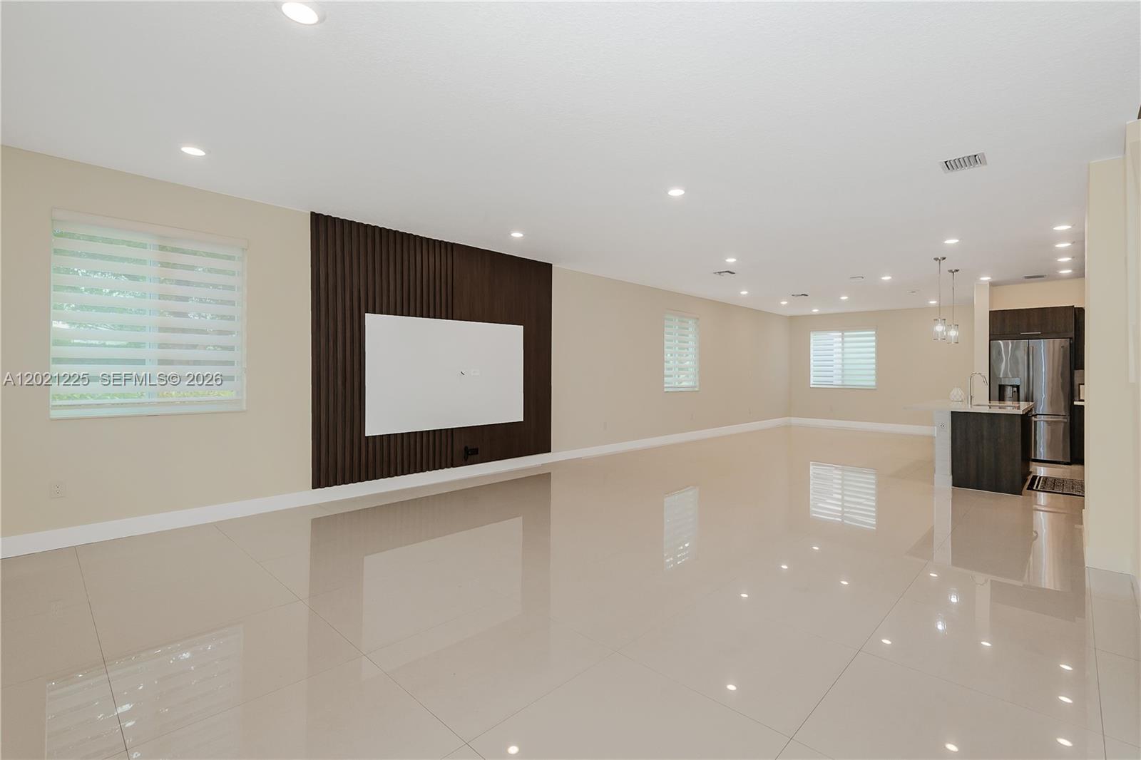 Modern corner townhouse with private NEXT-GEN studio in highly sought-after Landmark at Doral. This spacious 2-story, loft-style residence offers 4 bedrooms and 3.5 bathrooms in total, including a fully equipped private studio with its own entrance, kitchen, bathroom, laundry, and dedicated side parking—perfect for in-laws, guests, a home office, or can be rental income. This Separate unit from the main House can also be rented  out for over $1800 per month making this an excellent opportunity for investors or families seeking additional cash flow. Flooded with natural light from its premium corner lot, the home features an open modern layout, oversized porcelain tile floors, wood stairs, high-impact windows and doors, and a sleek kitchen with stainless steel appliances, wall oven, and quartz countertops. The generous primary suite includes a huge walk-in closet, and the 2-car garage provides plenty of storage and convenience.Residents enjoy a true resort-style lifestyle with an impressive clubhouse offering a sparkling pool and kids’ splash park, tennis courts, fitness center, spa/sauna, game and social rooms, open-air amphitheater, and multiple parks and BBQ areas. Ideally located near A-rated schools, including the renowned Doral International Math and Science Academy, this home is just minutes from Miami International Airport, major highways, top shopping centers, supermarkets, hospitals, and the vibrant dining and entertainment of Downtown Doral.