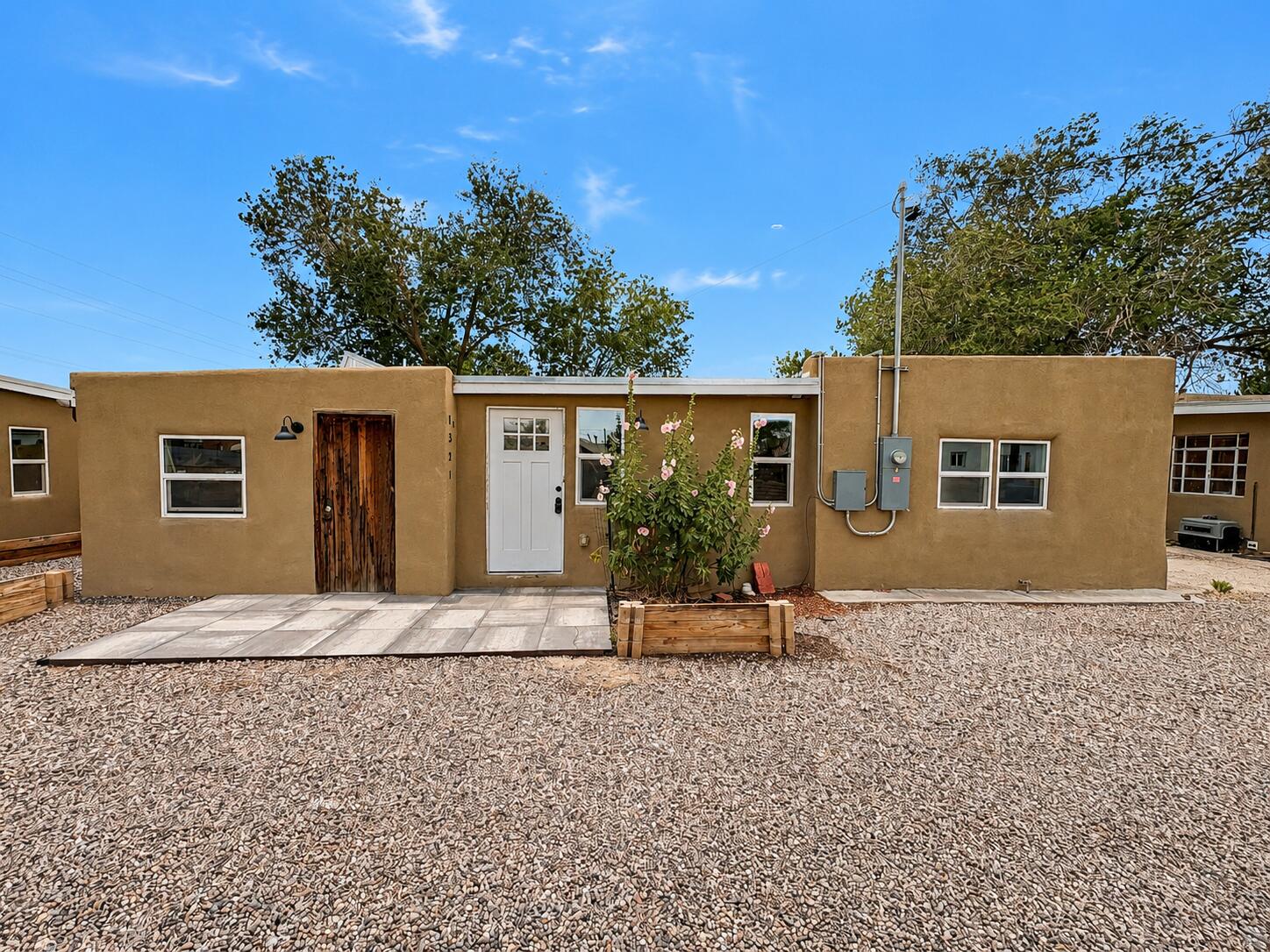 Updated Sawmill District Gem! Located in one of Albuquerque's most sought-after neighborhoods, this beautifully updated home offers the perfect blend of character and modern convenience. Extensive improvements include updated kitchen and bathrooms, flooring, roofing, windows, stucco, plumbing, water lines, electrical systems, and more. Enjoy easy access to Old Town, Sawmill Market, museums, dining, parks, and Downtown Albuquerque. Whether you're looking for a primary residence, second home, or investment opportunity, this move-in-ready property offers exceptional value in a prime location.CAN BE SOLD IN PACKAGE WTH MLS 1104436 & OR 1104522