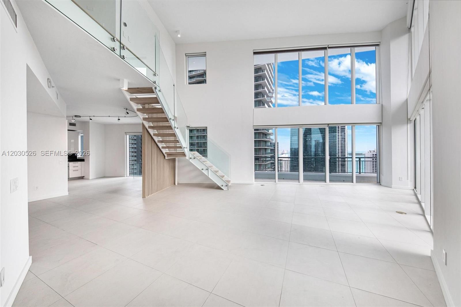 Spectacular two-story corner residence featuring 3 bedrooms, 3 full bathrooms, and a powder room. Floor-to-ceiling windows and soaring double-height ceilings showcase breathtaking panoramic views of the Miami skyline and Biscayne Bay while filling the home with natural light.The open-concept layout offers a modern kitchen, spacious living areas, custom walk-in closets, and elegant finishes throughout. Residents enjoy luxury amenities including a fitness center, resort-style pool, jacuzzi, spa, 24-hour concierge, and valet parking.Ideally located in the heart of Brickell, just steps from Brickell City Centre, Mary Brickell Village, premier dining, shopping, and entertainment.