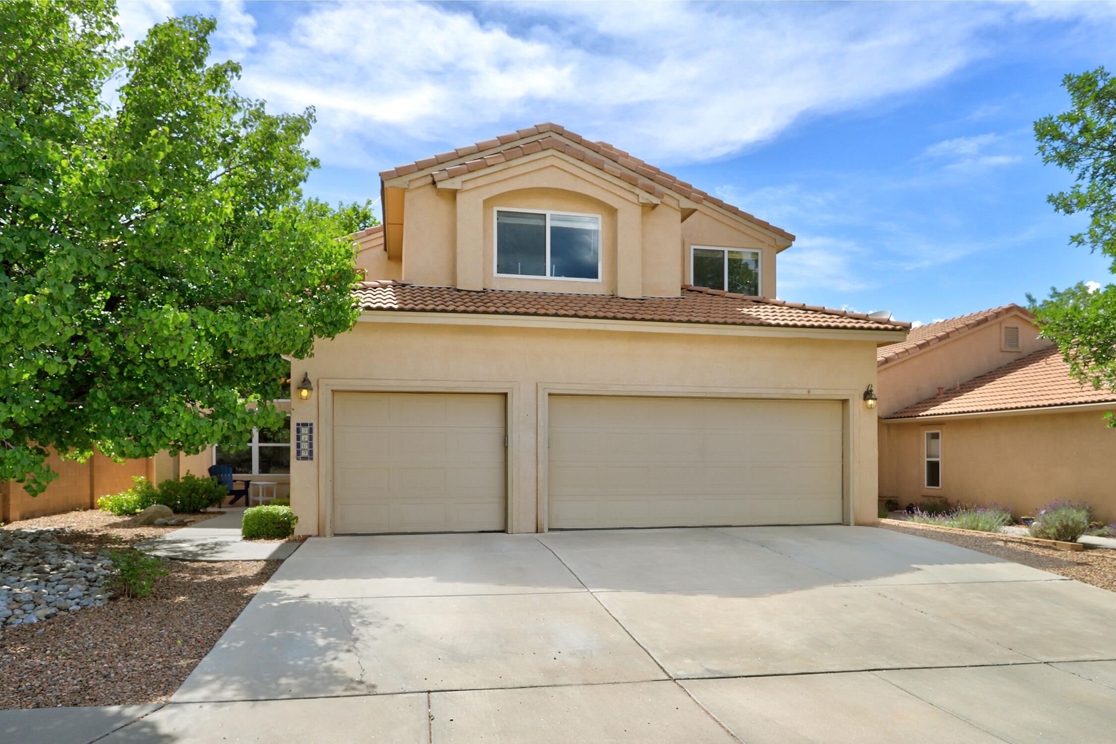 Price adjusted for a quick sale. Beautifully maintained 5-bedroom home that shows like a model in the highly desirable neighborhood of Desert Ridge Trails with parks & top-rated schools! This spacious 2-story home features 3 full bathrooms, a 3-car garage, & an ideal floorplan w/1 bedroom & full bath conveniently located on the main level. Enjoy multiple living spaces perfect for entertaining, working from home, or multi-generational living. The updated kitchen features newer countertops and opens nicely to the living spaces. Step outside to a beautiful backyard and take in the amazing Balloon Fiesta views right from your own home! Conveniently located near parks, shopping, dining, & schools. A rare opportunity to own a spacious home in an outstanding location!  This one won't last long