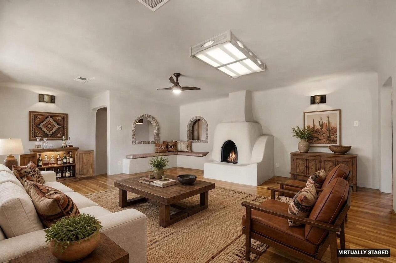 Experience the timeless charm of the North Valley in this authentic adobe heritage home, perfectly situated on a half-acre parcel with coveted irrigation rights. Surrounded by mature cottonwoods and productive fruit trees, this rare property offers a peaceful retreat just minutes from Old Town and Albuquerque's renowned 26-mile Bosque Trail system. The beautifully appointed kitchen features a new refrigerator and oven, while newly installed refrigerated air provides year-round comfort. Unwind in the premium Northern Lights cedar soaking tub, designed for both hot and cold therapy. A separate brick-floor casita offers ideal space for guests, a studio, or home office. This unique North Valley oasis blends historic character, modern upgrades, and an exceptional outdoor lifestyle. Rare opportunity to purchase the adjacent lot which also has irrigation rights. Turn it into your own conservation easement, lease to horse owners in the area for extra income, or build another home and create a private family north valley compound. See MLS 1107731.