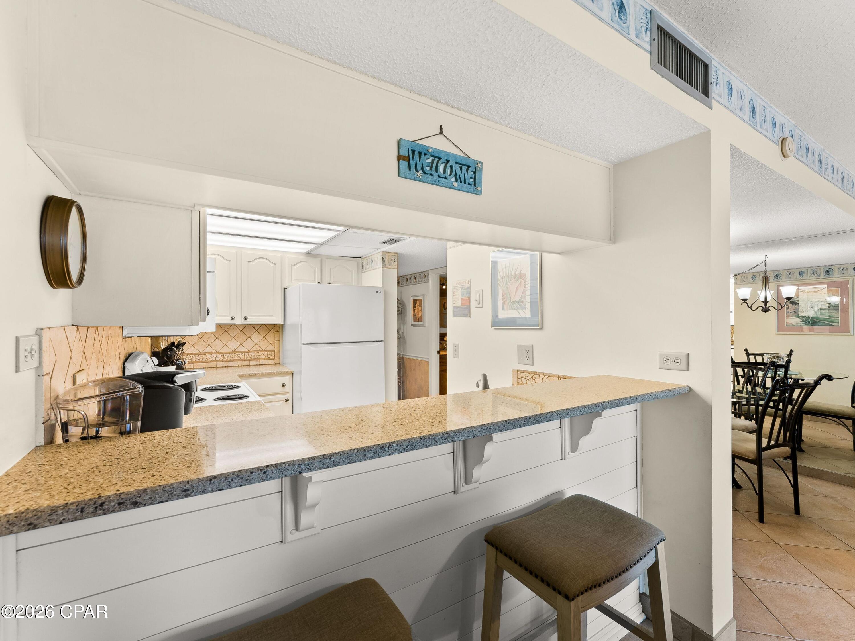 Listing Photo 1 - Condo for sale in building located at 6213 Thomas Dr, Panama City Beach, FL 32408 - Unit #102