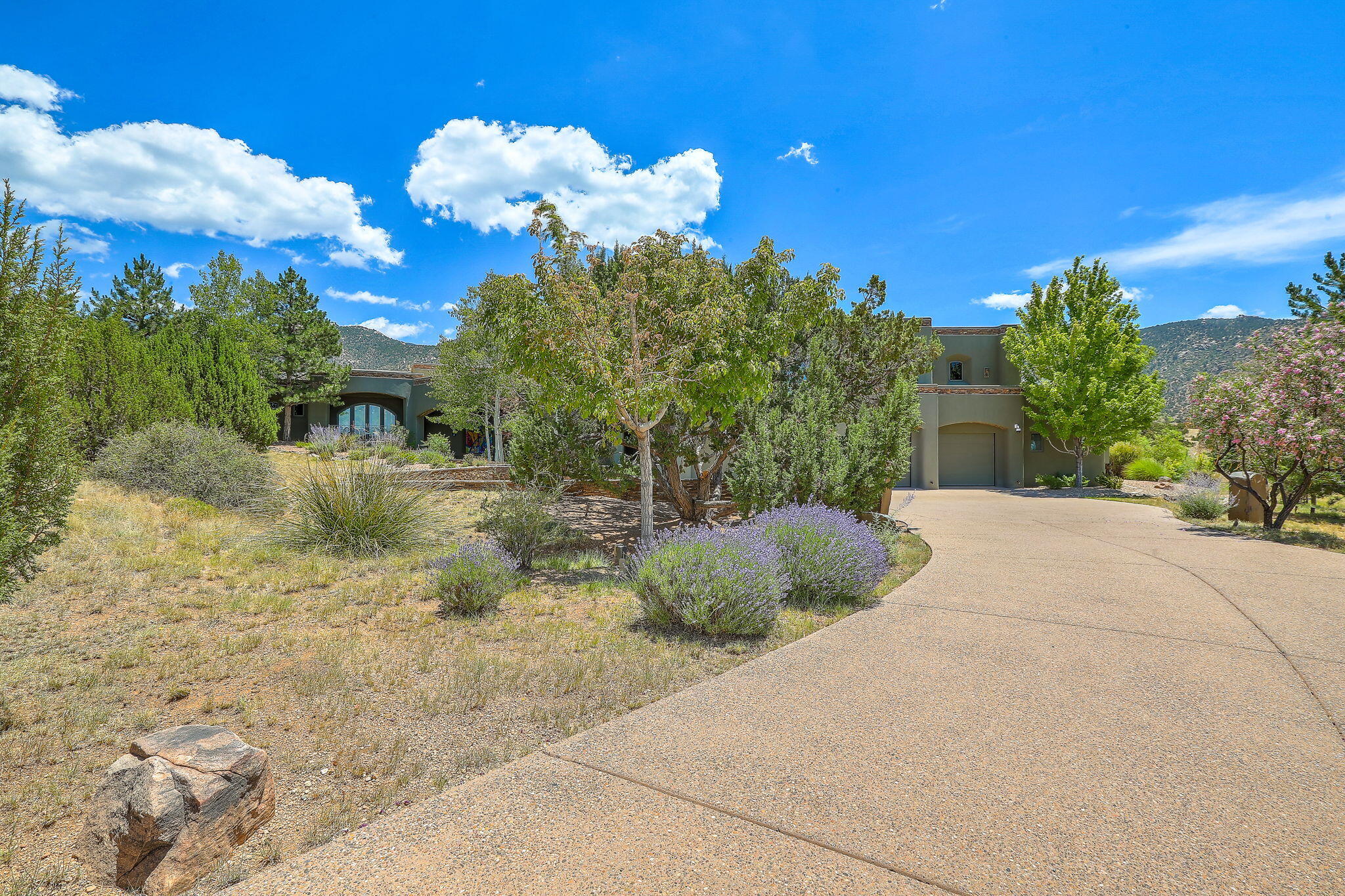 Perched at the pinnacle of High Desert, this extraordinary Custom Built luxury home sits on a private 2.37 acres lot and offers National Forest Views, unmatched privacy, and masterful design throughout. With 4 dedicated bedrooms, including a self-contained guest suite, plus two flexible rooms perfect for a home office and craft space, this home blends spacious living with thoughtful functionality. As you approach the home, you're greeted by an elegant water feature that flows beside a custom fire pit, creating a stunning and serene entry experience that sets the tone for the rest of the property. Bedrooms/Office all have window and balcony views. creating indoor-outdoor living and maximizing the incredible vistas. Designed for both elegance and practicality... PLEASE CLICK ''MORE'