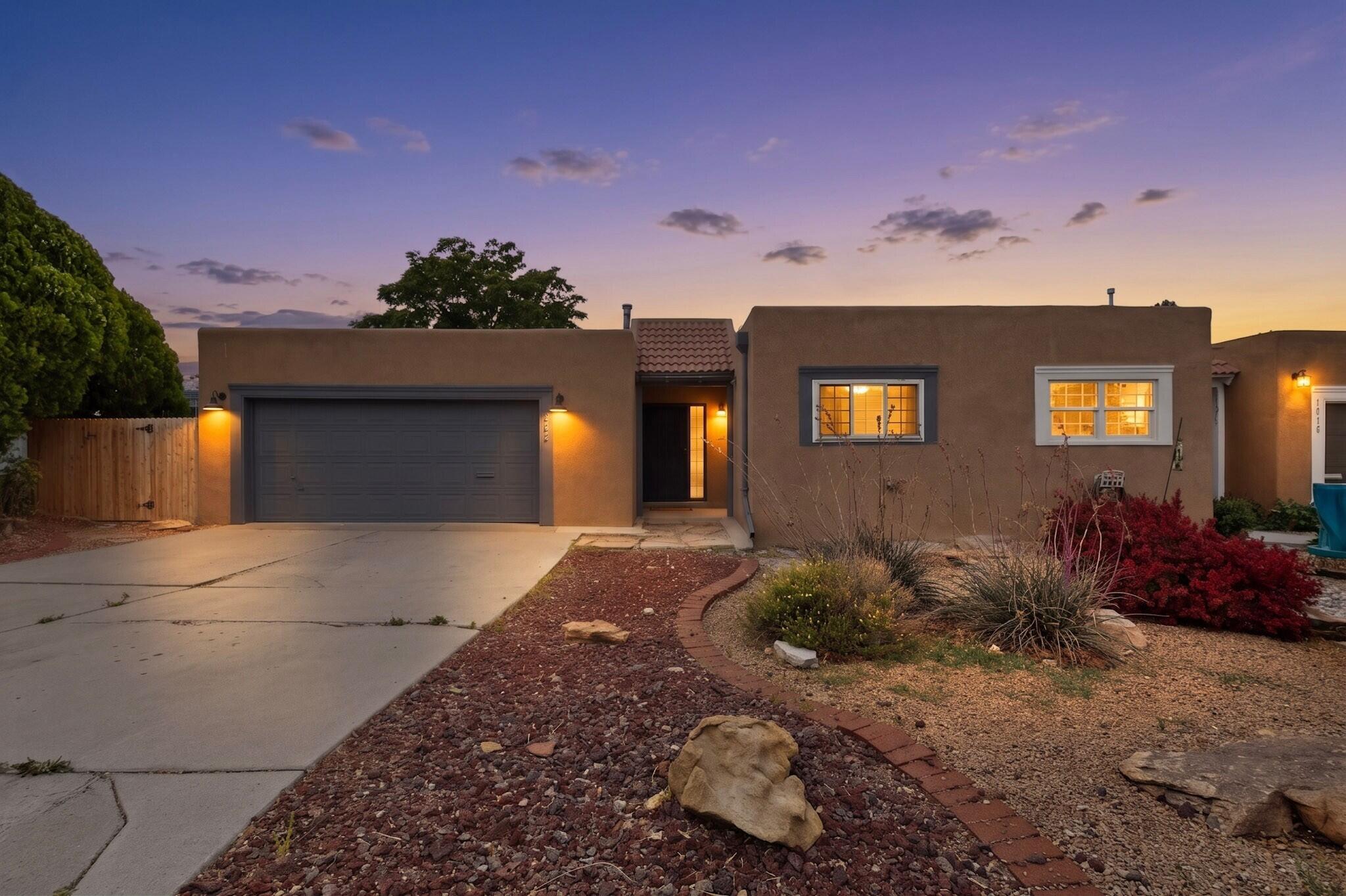 Turn-key and completely remodeled, this stunning 3-bedroom, 2-bath home blends modern updates with timeless charm. The beautifully renovated kitchen features updated cabinetry, granite countertops, subway tile backsplash, open shelving, designer lighting, vented range hood with exterior exhaust, built-in granite breakfast nook, and updated appliances. The spacious living room showcases exposed beams, skylights, luxury flooring, and a cozy fireplace. Enjoy the convenience of a custom-built-in office space with floating wood desks and shelving, perfect for working from home. Both bathrooms have been fully updated with new vanities, fixtures, and stylish finishes, including floor-to-ceiling tile surrounds and a spa-like primary shower with a sleek glass enclosure. New roof in 2021. A MUST SEE