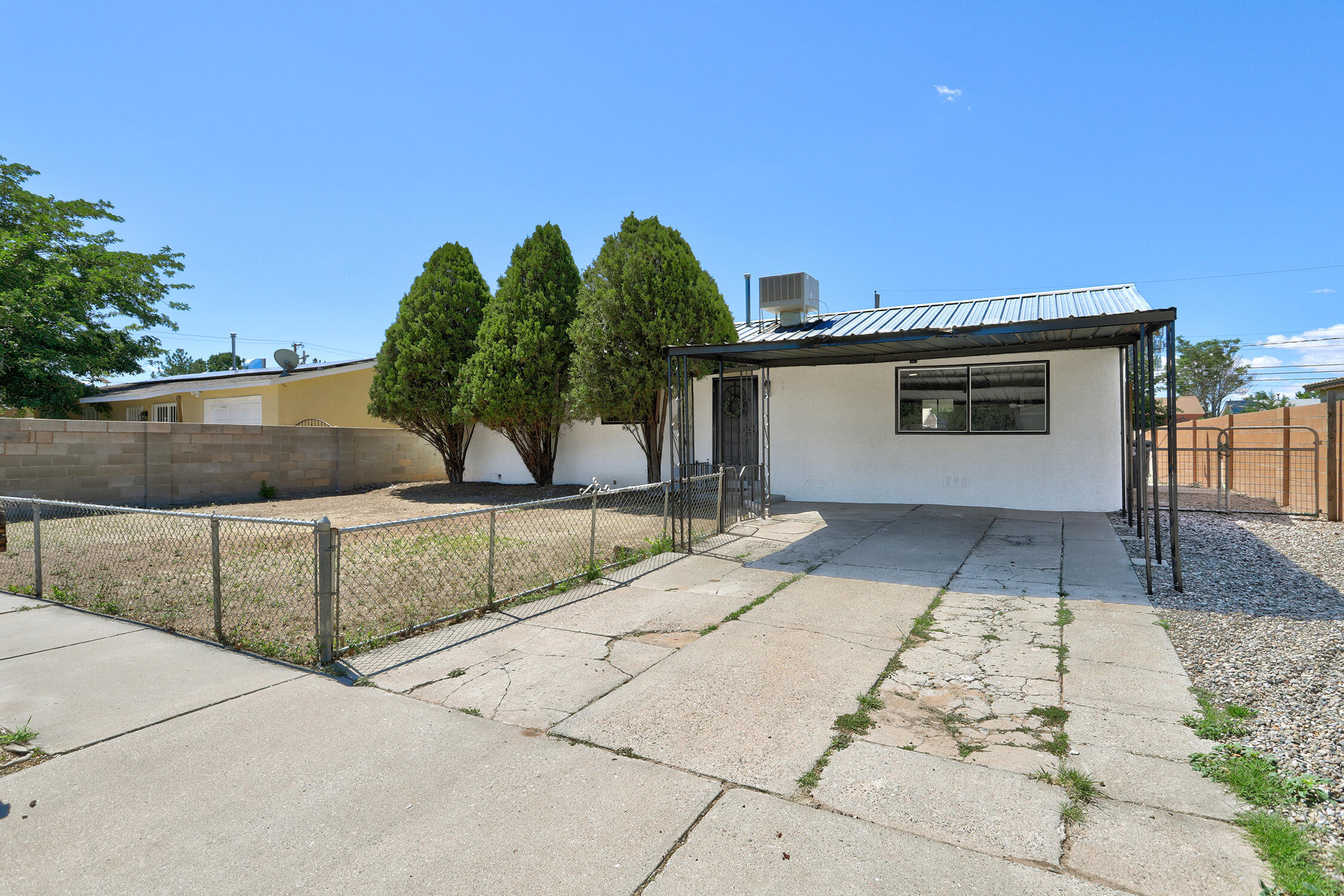 Beautifully restored and perfectly located! Just one block from a lush neighborhood park, with quick access to I-40 and only minutes from the restaurants, breweries, shopping, and entertainment of Sawmill and Old Town. Inside, you'll love the expansive open great room, oversized primary suite with dual closets, spacious utility room, updated bathrooms, and a large covered patio for outdoor living. Upgrades include new luxury vinyl plank flooring (tile in baths), stylish new cabinetry, new appliances, energy-efficient vinyl thermal windows, no carpet, and a durable pitched metal roof. Move-in ready with modern style and exceptional convenience! A must-see...