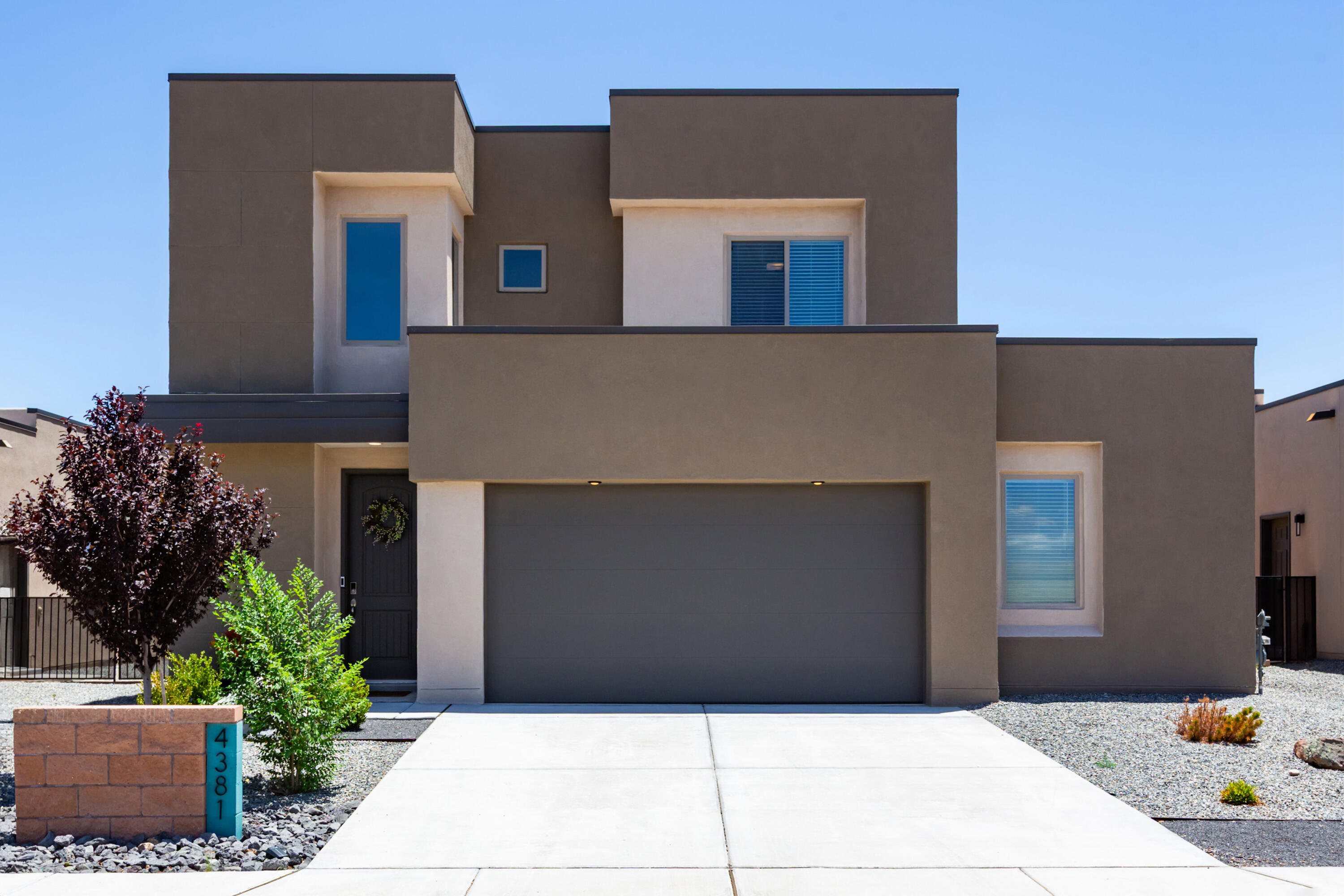 Why wait to build? Completed in 2024, this move-in ready Rio Rancho home offers modern style, flexible living spaces, and mountain views without the wait. A dramatic two-story entry with soaring ceilings welcomes you into an open-concept floor plan filled with natural light. The spacious kitchen features granite countertops, a large island with bar seating, walk-in pantry, and seamless flow to the living and dining areas. Offering 3 bedrooms plus a flexible office or 4th bedroom and an oversized loft, there's room for every lifestyle. The private primary suite boasts a walk-in closet, mountain views, and balcony access. Outside, enjoy a low-maintenance backyard with turf, covered patio, hot tub pad, and space to relax or entertain. Stylish, nearly new, and move-in ready!