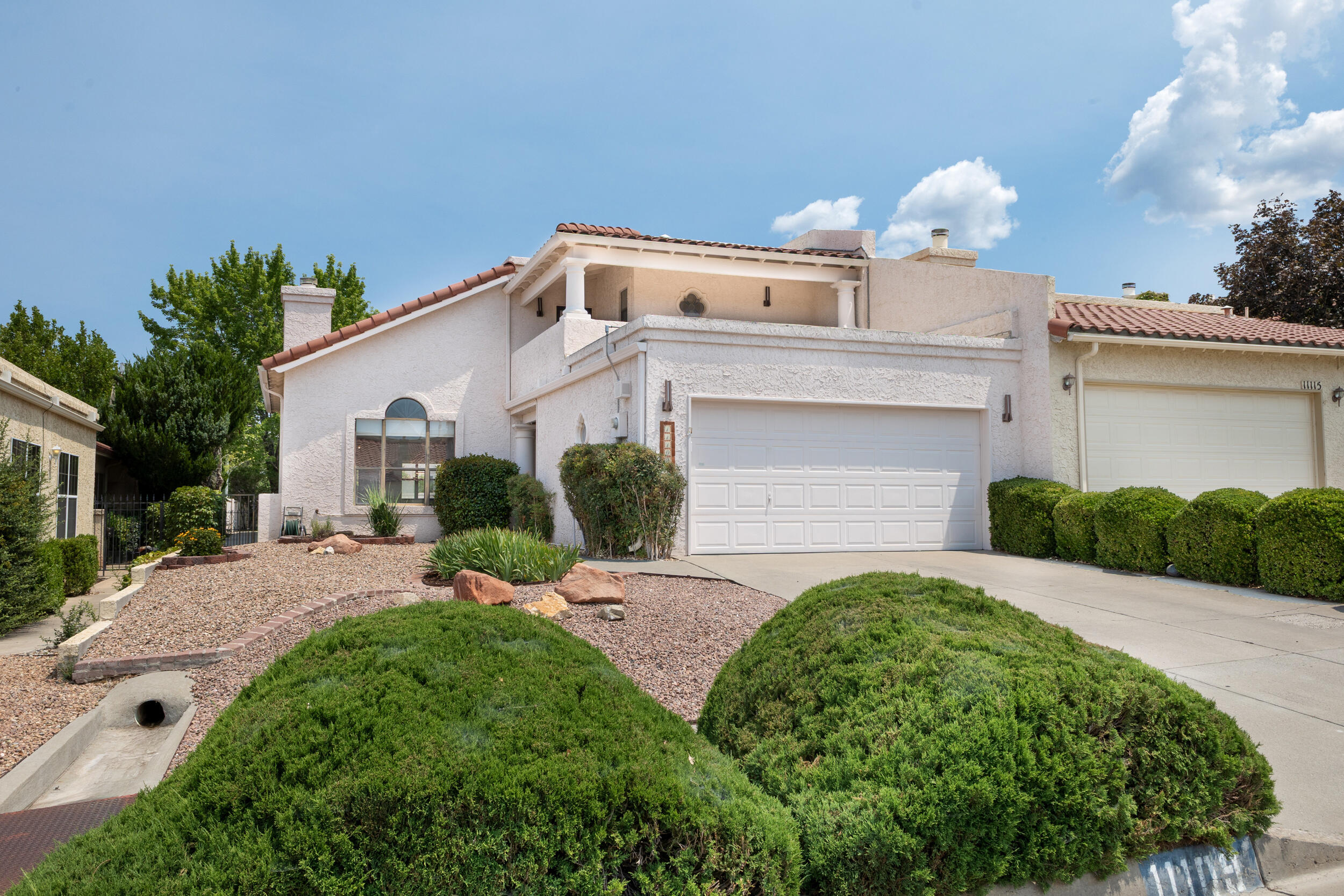 Welcome home to this beautifully updated 3-bedroom, 2-bath townhome. The remodeled kitchen and bathrooms offer modern style and functionality, while recent updates provide added peace of mind, including a new door spring and opener (2026) for the 2-car garage, new blinds (2025), and a TPO roof (2019). The heating and cooling combo unit is only four years old, and provides refrigerated air for added efficiency and comfort. Enjoy beautiful views from the balconies, a security system, and fully landscaped front and back yards, complete with a drip irrigation system in the front yard and sprinklers in the back. There is also a beautiful park walking distance from the home. This move-in-ready home combines thoughtful updates, low-maintenance living, and a great location you'll love.