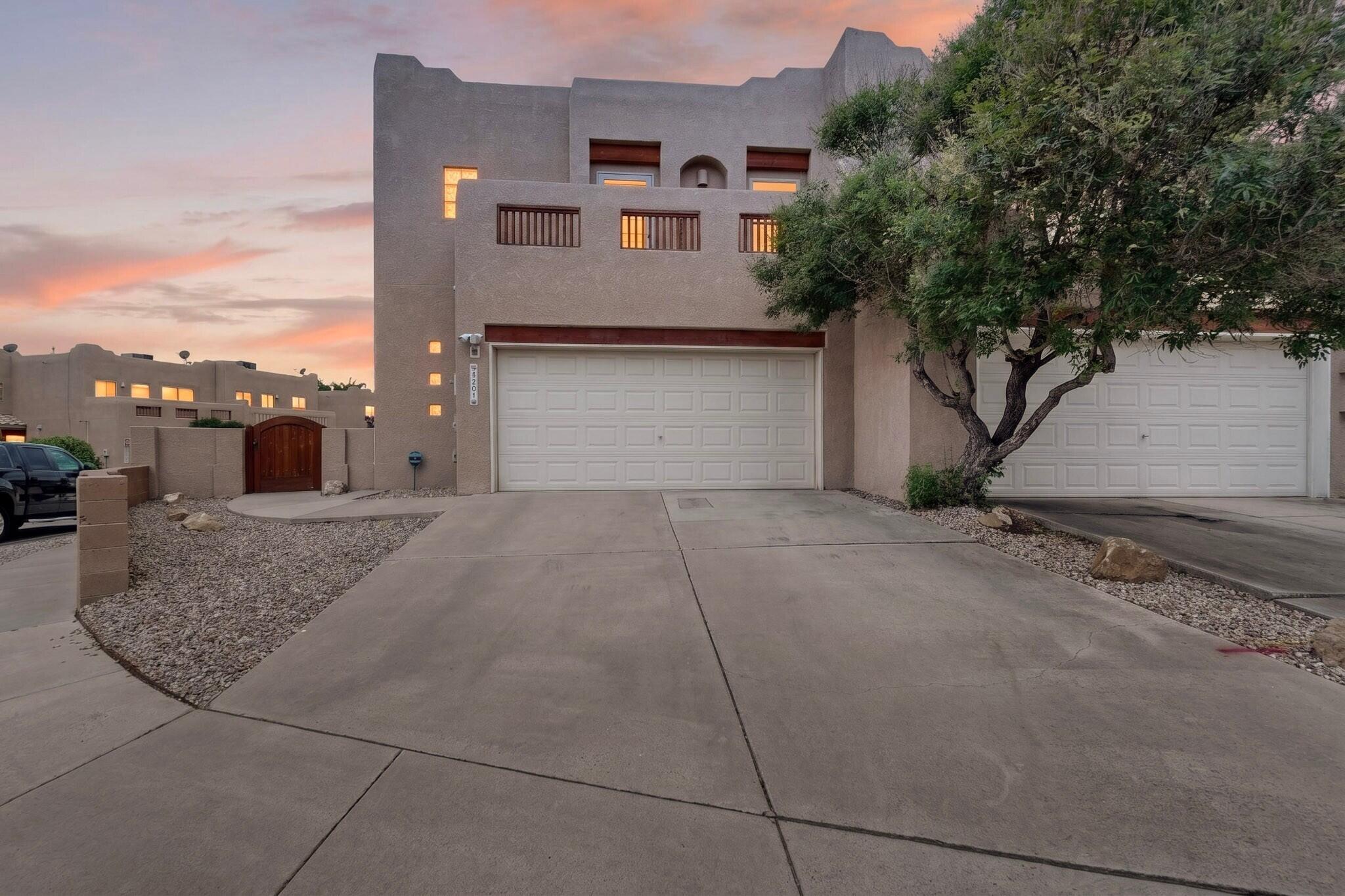 Check out this gorgeous home in the highly desirable Spanish Sun subdivision! Location is everything, and this hidden gem is tucked away in a quiet neighborhood while remaining close to all the conveniences of Northeast Albuquerque. Enjoy easy access to shopping, dining, entertainment, and the freeway--everything you need is just minutes away. This impeccably maintained residence offers the perfect blend of comfort and convenience. Inside, you'll find stunning hardwood floors throughout, premium multi-tone granite countertops, and a well-appointed kitchen featuring sleek stainless steel appliances. The unique floor plan creates an inviting space that is ideal for both everyday living and entertaining. Upstairs, you'll discover bright and spacious bedrooms, along with a conveniently located