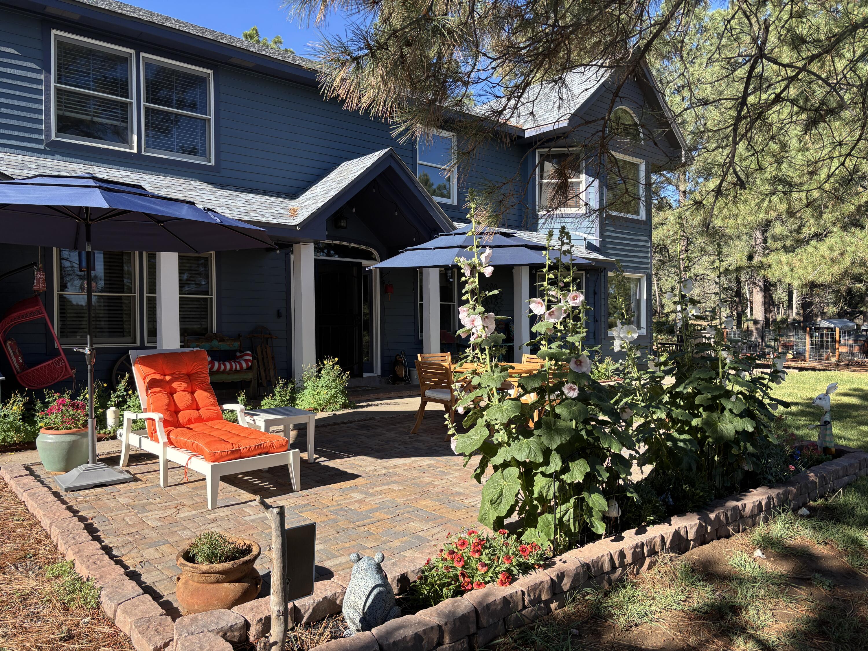 This gorgeous custom mountain home has been meticulously maintained. It is centered among tall pine trees and lush landscaping. It is located on 2 tracts totaling 10 acres that are fully fenced with 2 gated entrances. It has both attached and detached garages, a barn, a horse corral, a chicken coop area, a gazebo, and a well house. The private well is 420 ft with new pump, PVC, and wiring in 2024. New septic tank and roof in 2021.