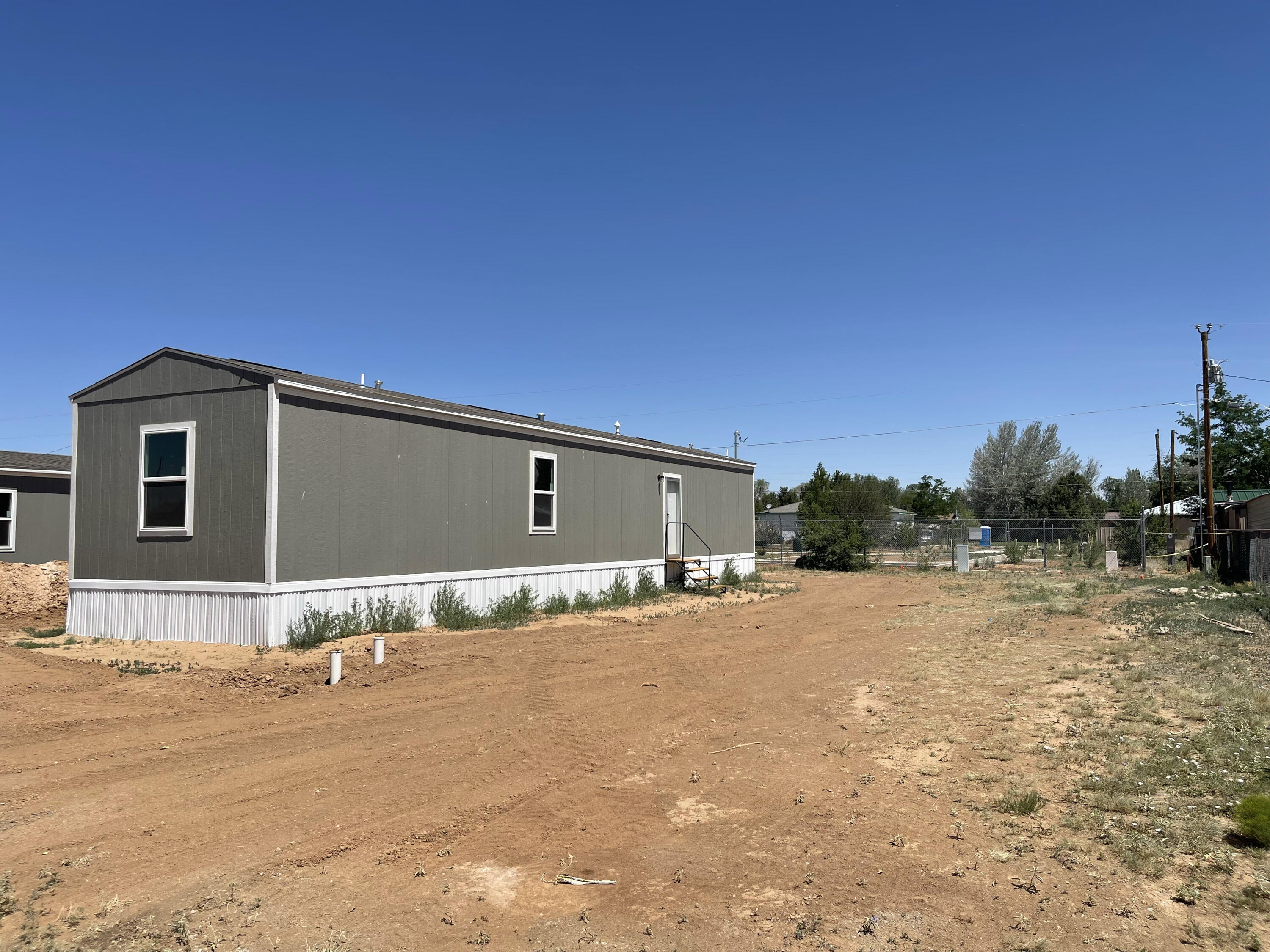 Be the first to own this brand-new 2026 Clayton manufactured home offering 2 bedrooms, 2 bathrooms, and modern comfort throughout. The open-concept floor plan features a bright living area, spacious kitchen, and thoughtfully designed layout ideal for everyday living. Enjoy year-round comfort with refrigerated air, plus the convenience of city water and city sewer.Located next to a city park, you'll appreciate easy access to green space, recreation, and outdoor activities right outside your door. Conveniently situated just 35 minutes from Albuquerque, this home offers the perfect balance of small-town living with quick access to shopping, dining, employment, and entertainment.