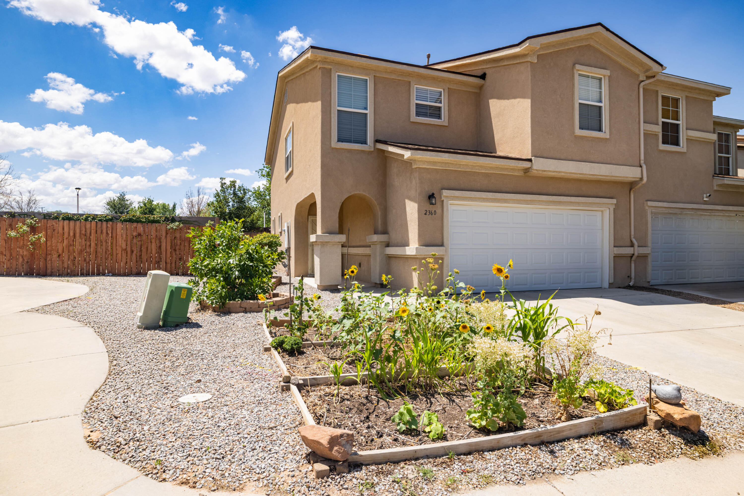 Welcome to this charming and spacious 3-bedroom, 2.5-bath townhome with a loft, ideally located near UNM, Nob Hill, and with easy freeway access. The raised front garden bed adds great curb appeal. Inside, you'll find an open floor plan with laminate flooring throughout the main living areas. The kitchen features a center island with a custom wood bar and tile backsplash. All appliances convey. Upstairs, the spacious primary suite includes a walk-in closet, with the laundry area conveniently located nearby. Recent updates include a new sliding glass door and water heater (2026). Enjoy the landscaped backyard with coyote fencing for added privacy, and the added benefit of backing directly to a park. Best of all, there's no HOA! Truly A Great Place To Call Home.