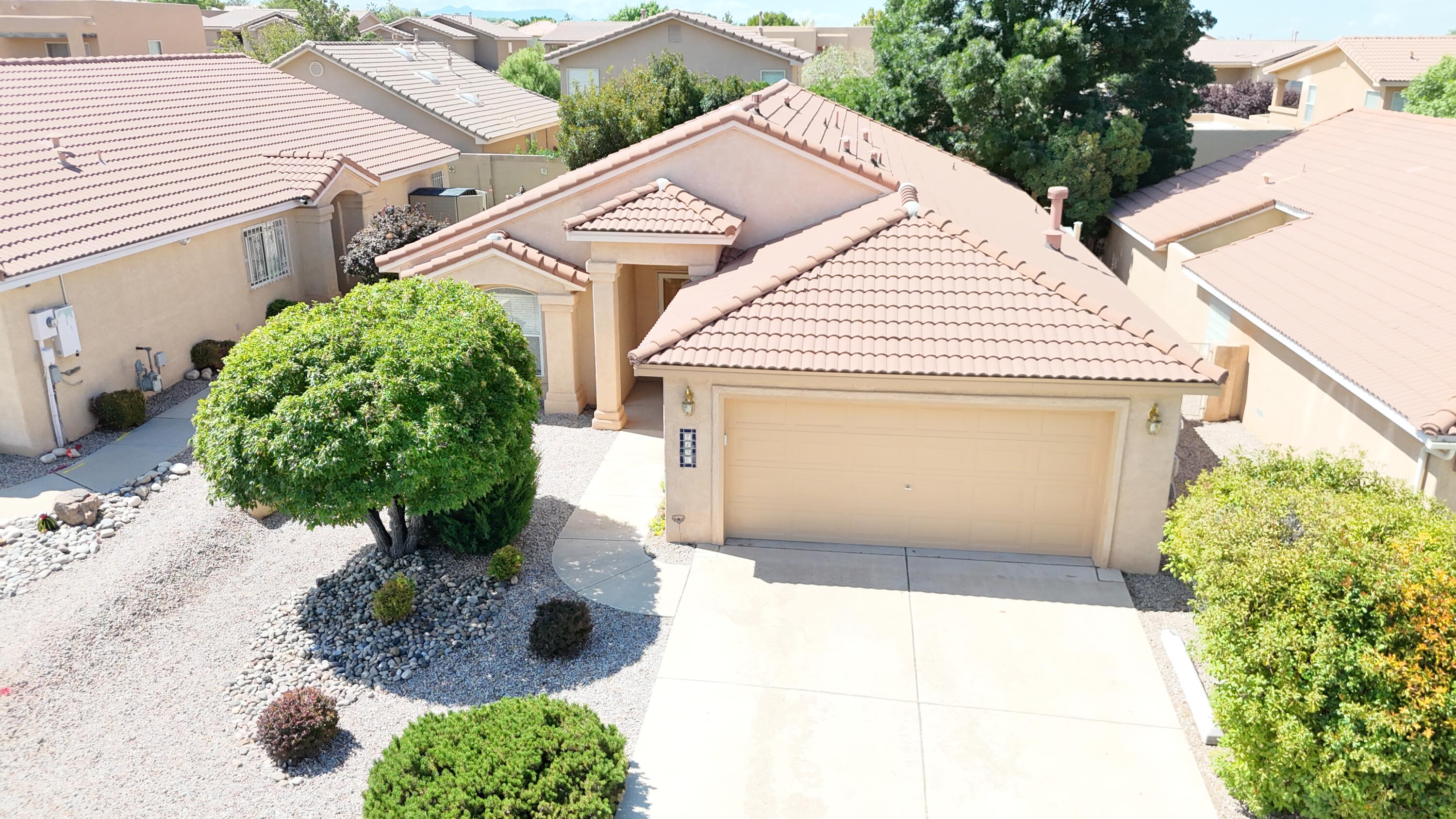 Beautiful Single Story Newman Construction 3BR, 2BA home w/open floor plan, pitched tile roof, refrig A/C & 5-zone radiant in-floor heat! Vaulted ceilings in LR, KT & primary BR. Tile floors thru out except carpet in primary & 2nd BR. KT features raised-panel oak cabs, SS appls, island, lg breakfast bar, pantry, BI microwave & recessed lighting. Sep dining area. Upgraded light fixtures & ceiling fans. Primary suite offers WI closet, dbl sinks, garden tub & separate shower. Hall BA w/tub-shower combo & cultured marble surround. Thermal dbl-pane windows. Laundry rm w/upper cabs. Washer, dryer & refrigerator convey. Finished 2-car garage w insulated door & pre-plumbed for water softener. Low maintenance landscaping front and back. Located in La Cueva school district. Move-in ready!