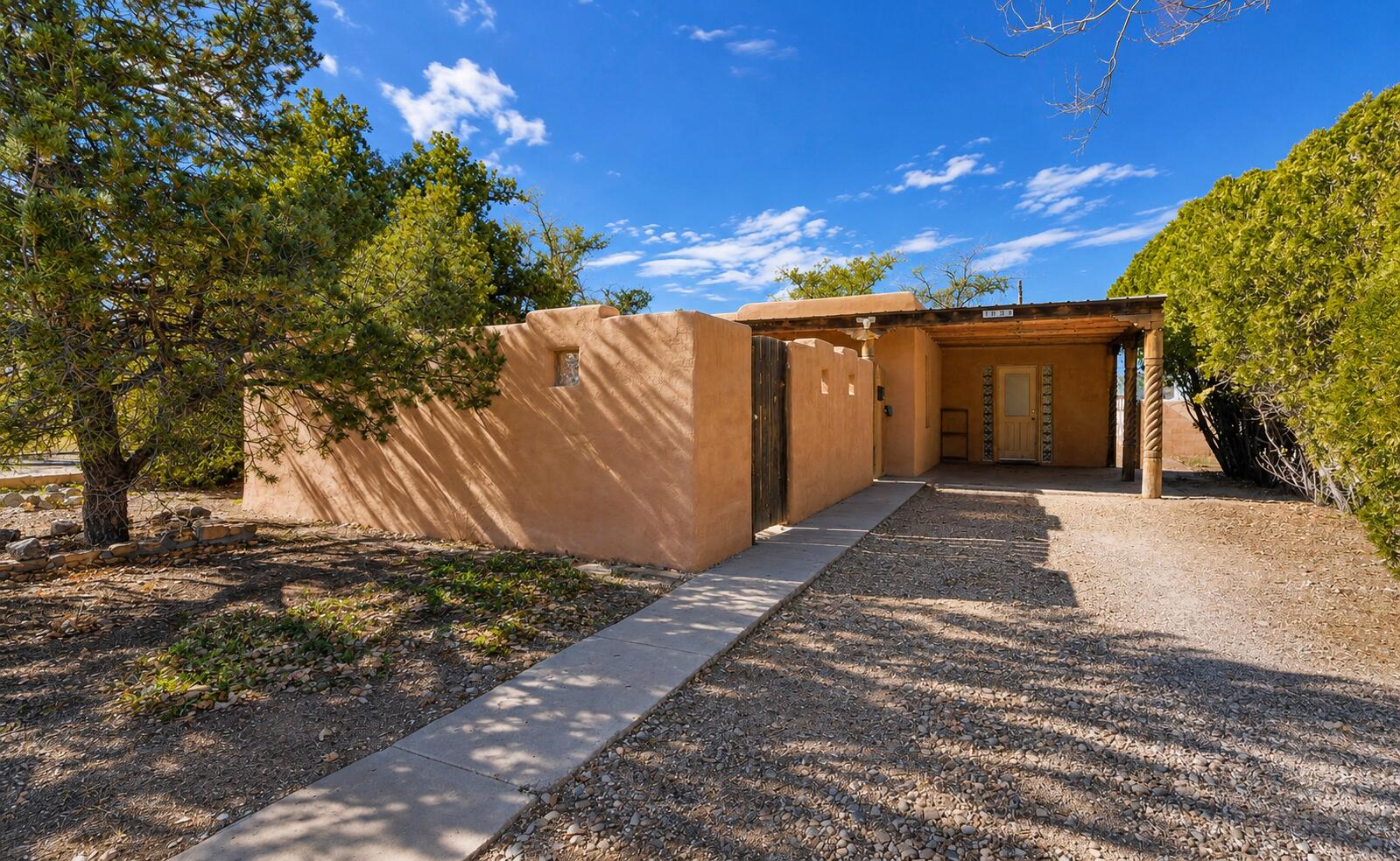 Charming Pueblo style home in the desirable UNM North Campus area. Behind the private courtyard gate you'll find a comfortable 3 bedroom, 1 bath home full of Southwestern character & thoughtful recent improvements. Features include a 2026 roof replacement, newer evaporative system, an inviting covered front portal, abundant natural light & a functional floor plan ready for its next owner. The spacious backyard is a blank canvas with room to garden, entertain, play, add outdoor living spaces or simply enjoy New Mexico's beautiful seasons. The private courtyard welcomes guests while creating a peaceful entrance to the home. Ideally located just minutes from UNM, UNM Hospital, the Law School, Medical School, Nob Hill, downtown, parks, shopping, dining & I 25 for commuter convenience.