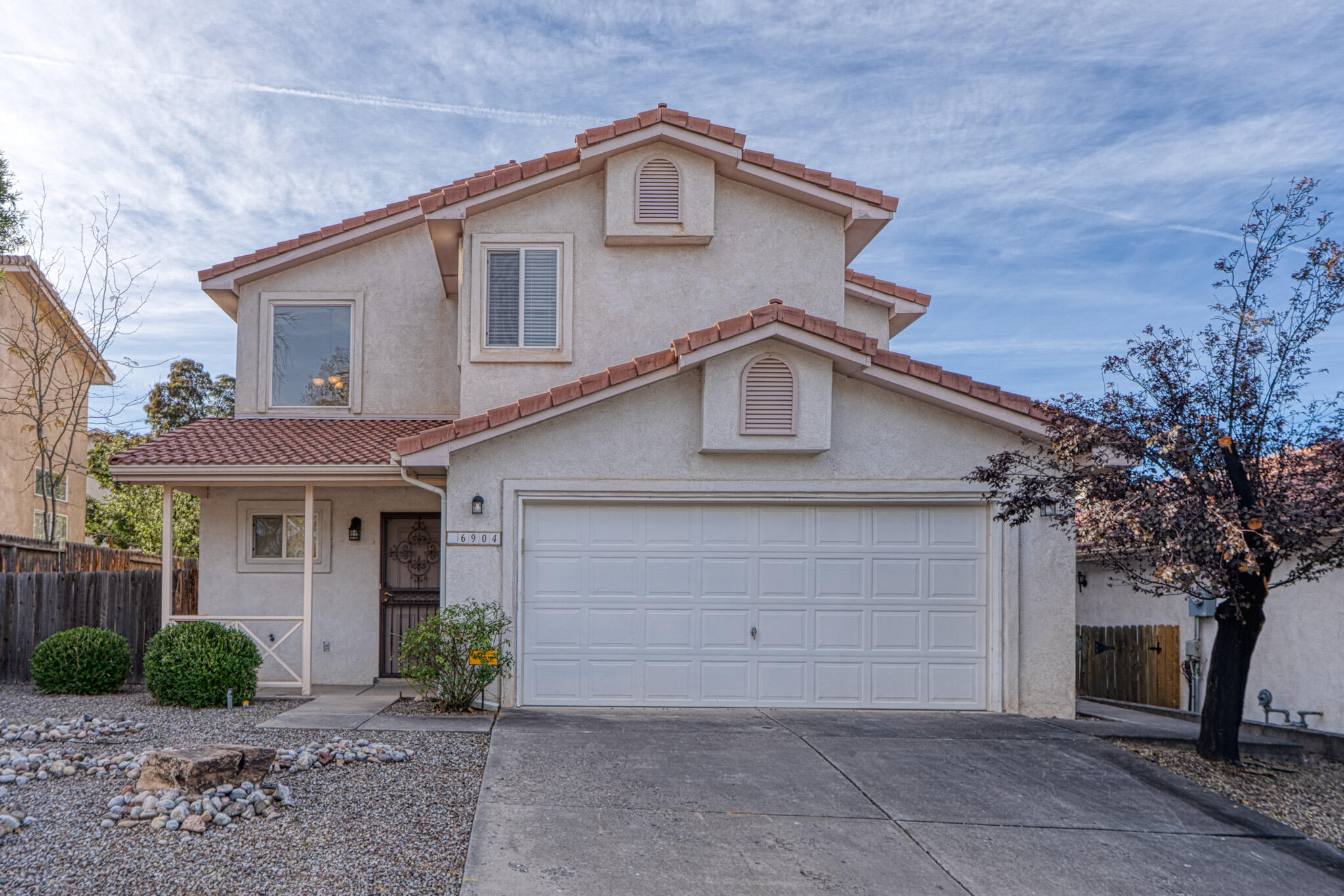 Beautifully maintained 3 bedroom home in the sought after La Cueva school district cluster.  Tiled roof, secure iron gates and updated lighting.  Brand new gas stove and dishwasher. The bright, open floor plan offers newer laminate flooring on the main level plus ceiling fans throughout.  Enjoy one of the largest backyards in the area with a built in flagstone benches and easy care landscaping.  Spacious side yard is perfect for dog run, shed or extra outdoor space. Move in ready and conveniently located near top schools, shopping and dining.