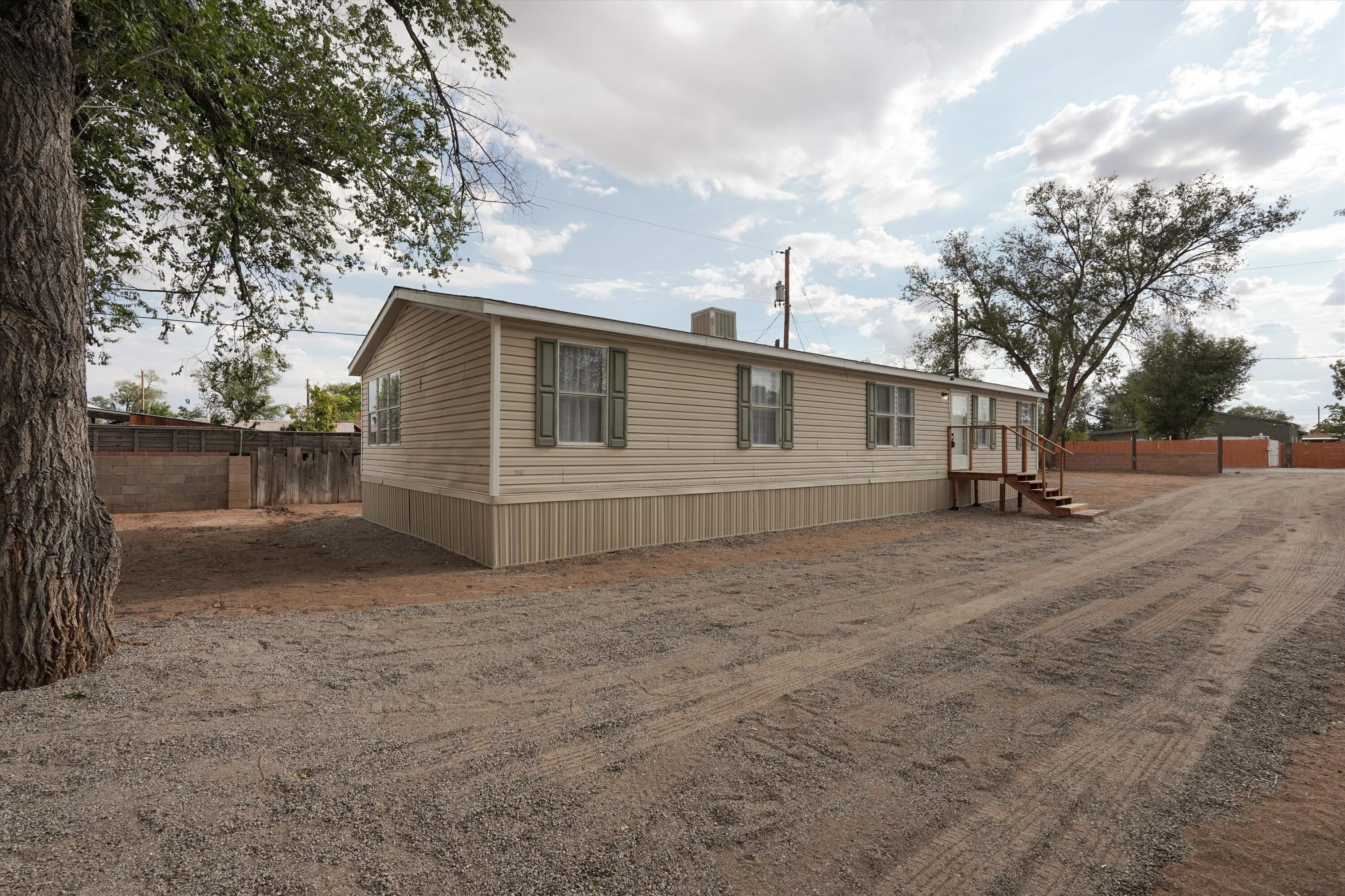 Move-in ready and full of potential! This 3-bedroom, 2-bath manufactured home in Southwest Albuquerque sits on a spacious lot with plenty of room for RV parking, gardening, pets, or future projects. Inside, you'll find a bright, open floor plan, comfortable living spaces, and a private primary suite. Enjoy the peace of having land while staying just minutes from shopping, dining, schools, and freeway access. A great opportunity to own a well-maintained home with space to grow!
