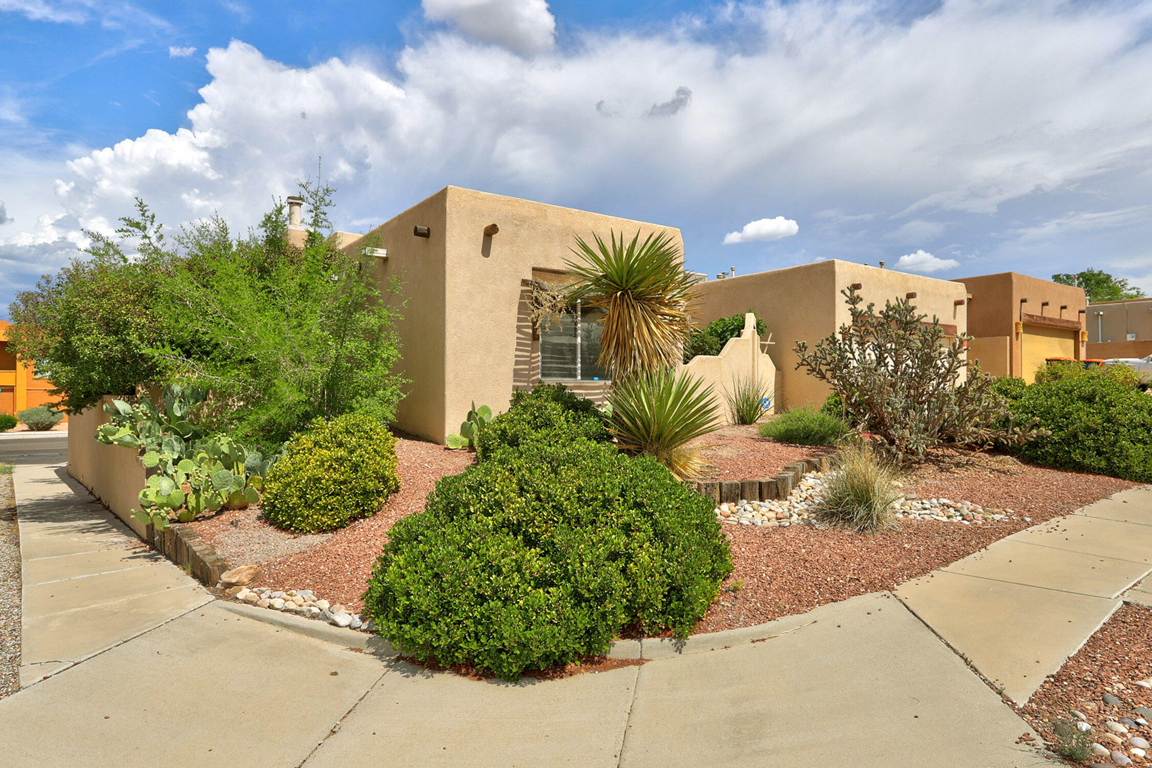 Welcome home! An incredibly convenient location and a spacious yet cozy layout. Note the beautiful landscaping in the private front courtyard, and grand foyer with high ceilings and a ton of light welcoming you inside. Primary suite on opposite side of the house from other two bedrooms. Kitchen opens into the dining room and family room so everyone can gather. The backyard is huge, and there's a lovely, covered patio to enjoy the evenings outdoors shaded from the sun. Enjoy mountain views from the family room and dining room windows. Beautiful!