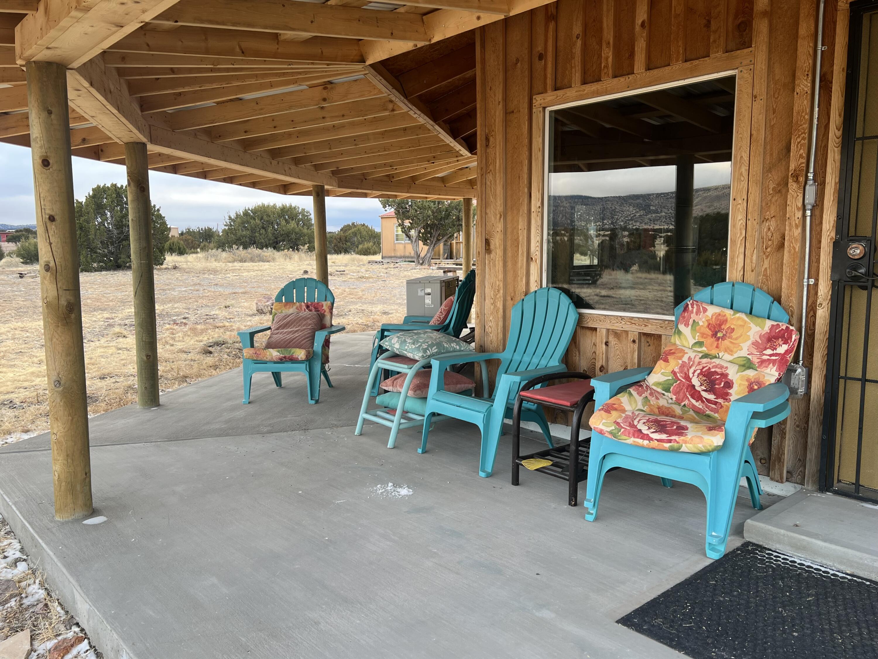 Discover your own New Mexico retreat on 10+ scenic acres in Magdalena Ranch Estates, just 3 miles west of historic Magdalena. This turnkey, move-in ready property features a charming 800+ sq. ft. home plus a separate 300 SF bunkhouse, offering endless possibilities for guests, multi-generational living, or rental income. Currently operating as a successful Airbnb, it's ideally located just 1/4 mile off Highway 60 & adjacent to State Land for added privacy & recreation. Efficient heating/cooling mini split. Enjoy panoramic mountain views, breathtaking enchanted sunsets, dark star-filled skies, & refreshing mountain air. The property is partially fenced, making it an ideal summer getaway, full-time residence, or income-producing investment in the heart of New Mexico's natural beauty.